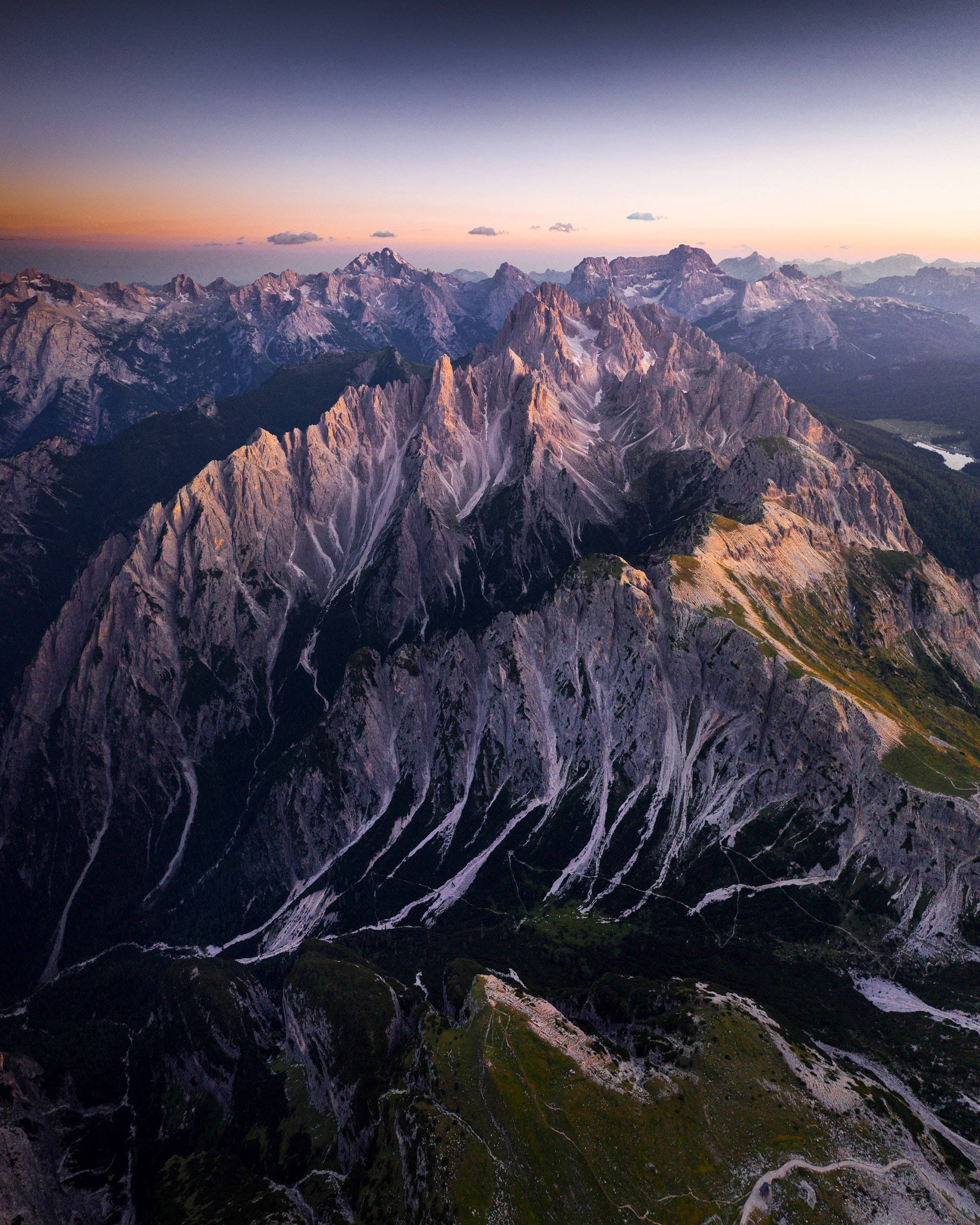 Mountain iPhone, jagged mountain peaks, golden sunset light, 2K Phone Wallpaper