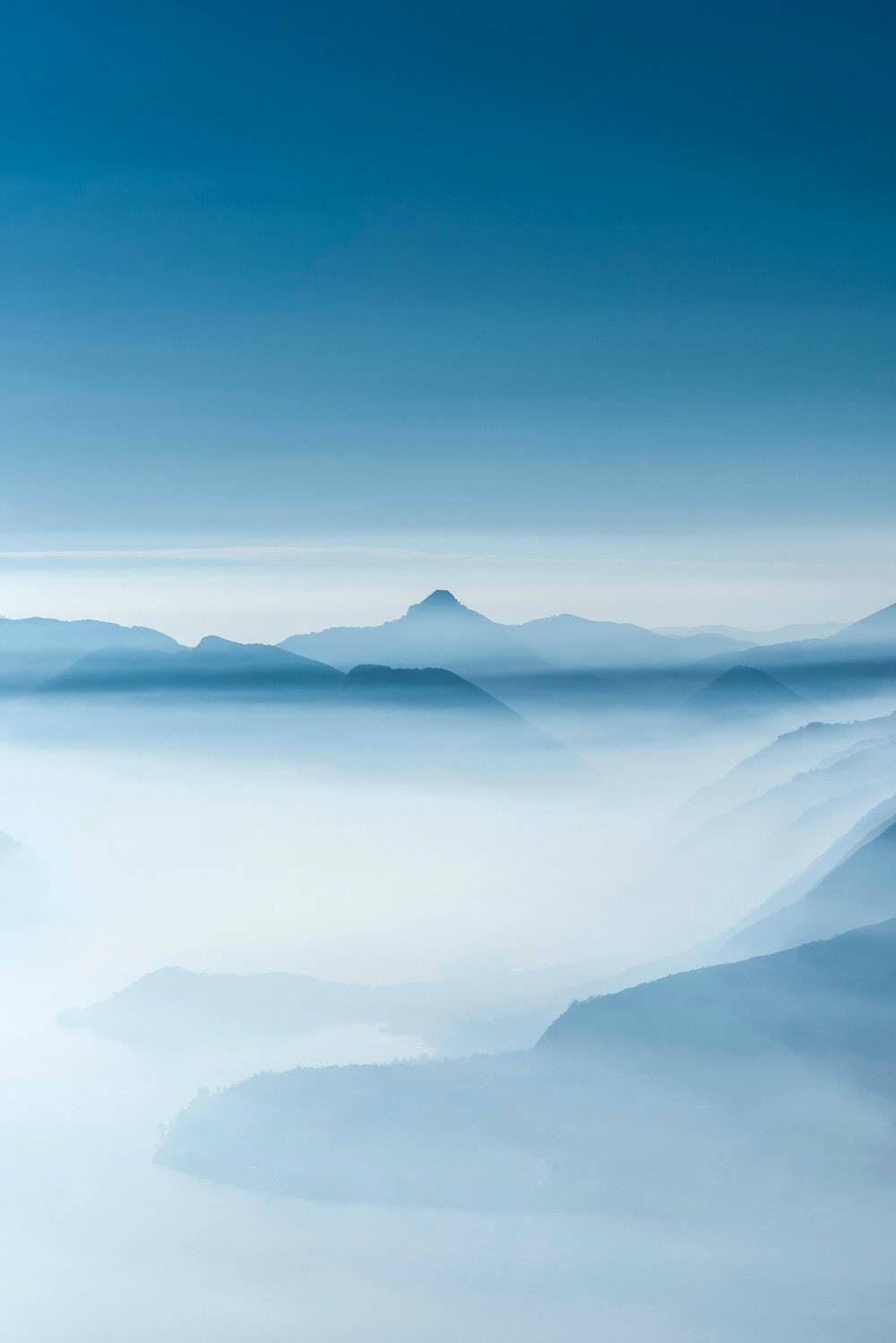 foggy mountains, serene mountain peaks, thick blue mist, HD Phone Wallpaper