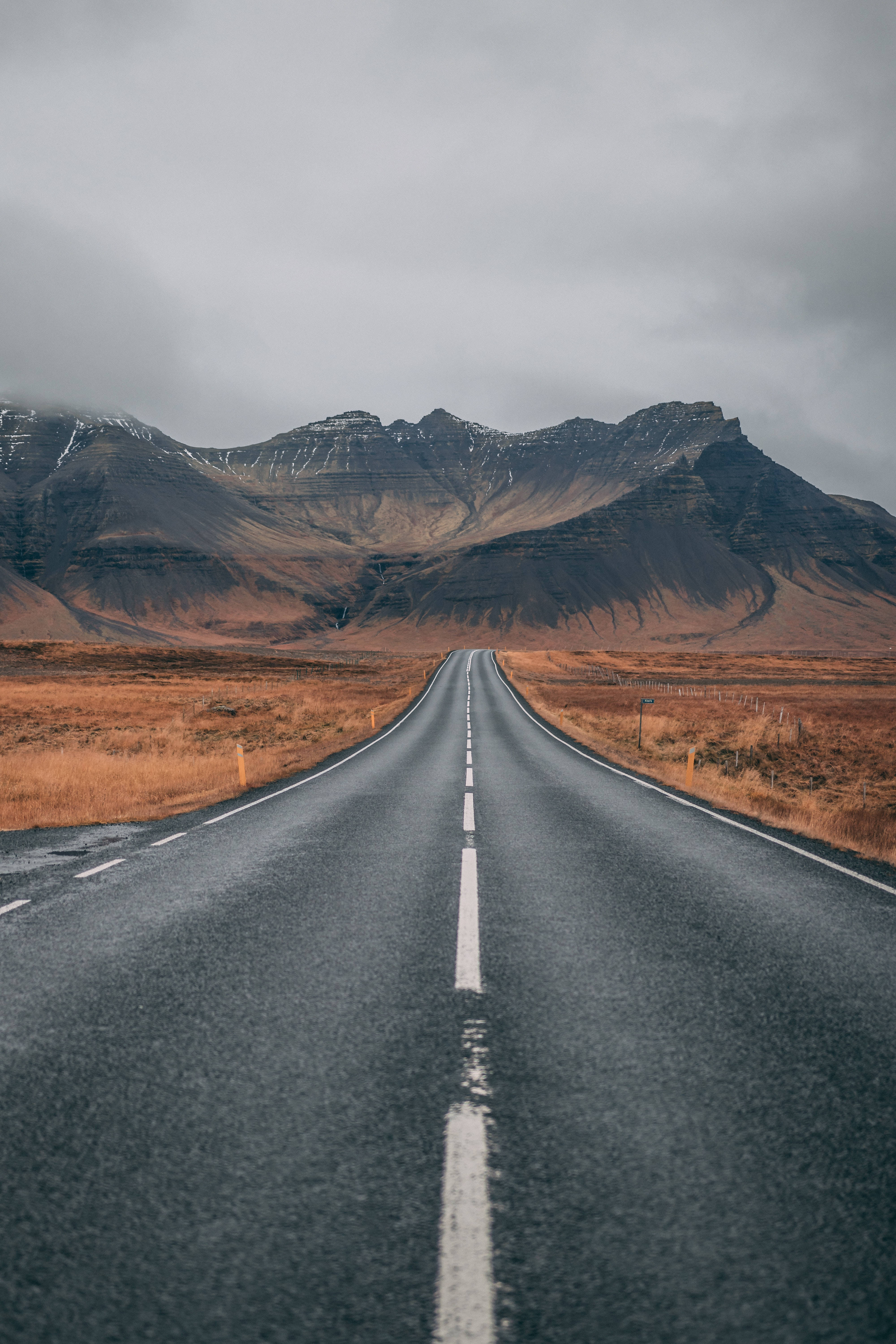 Mountain iPhone, asphalt road, snow-dusted mountains, 5K Phone Wallpaper
