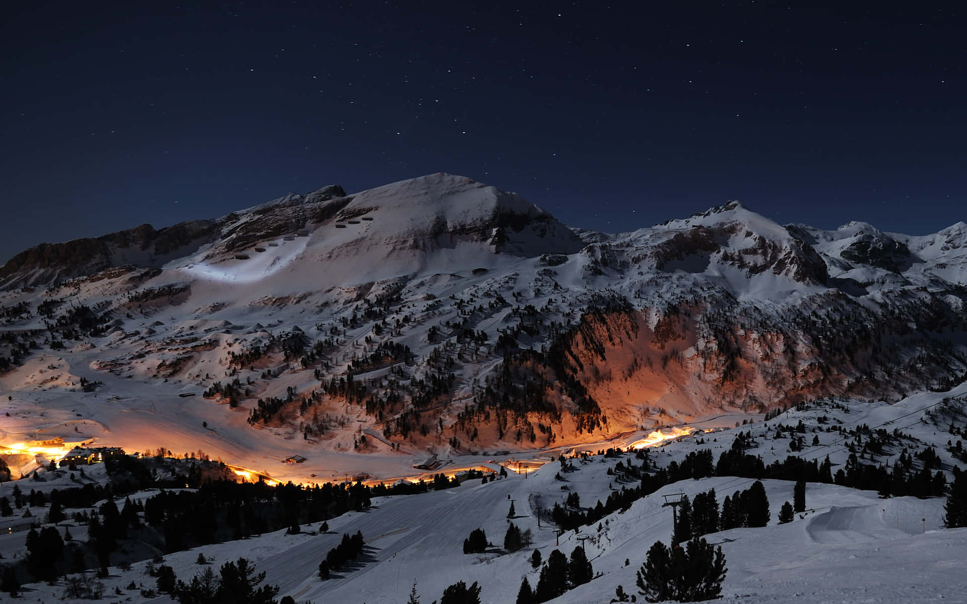 snowy mountain peaks, starry night sky, warm lights, Full HD Desktop Wallpaper