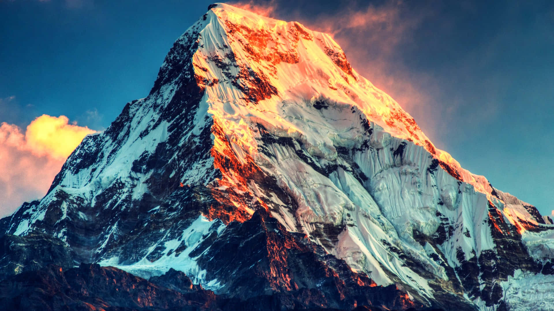 snowcapped mountain peak, golden sunrise light, deep blue sky, Full HD Desktop Wallpaper