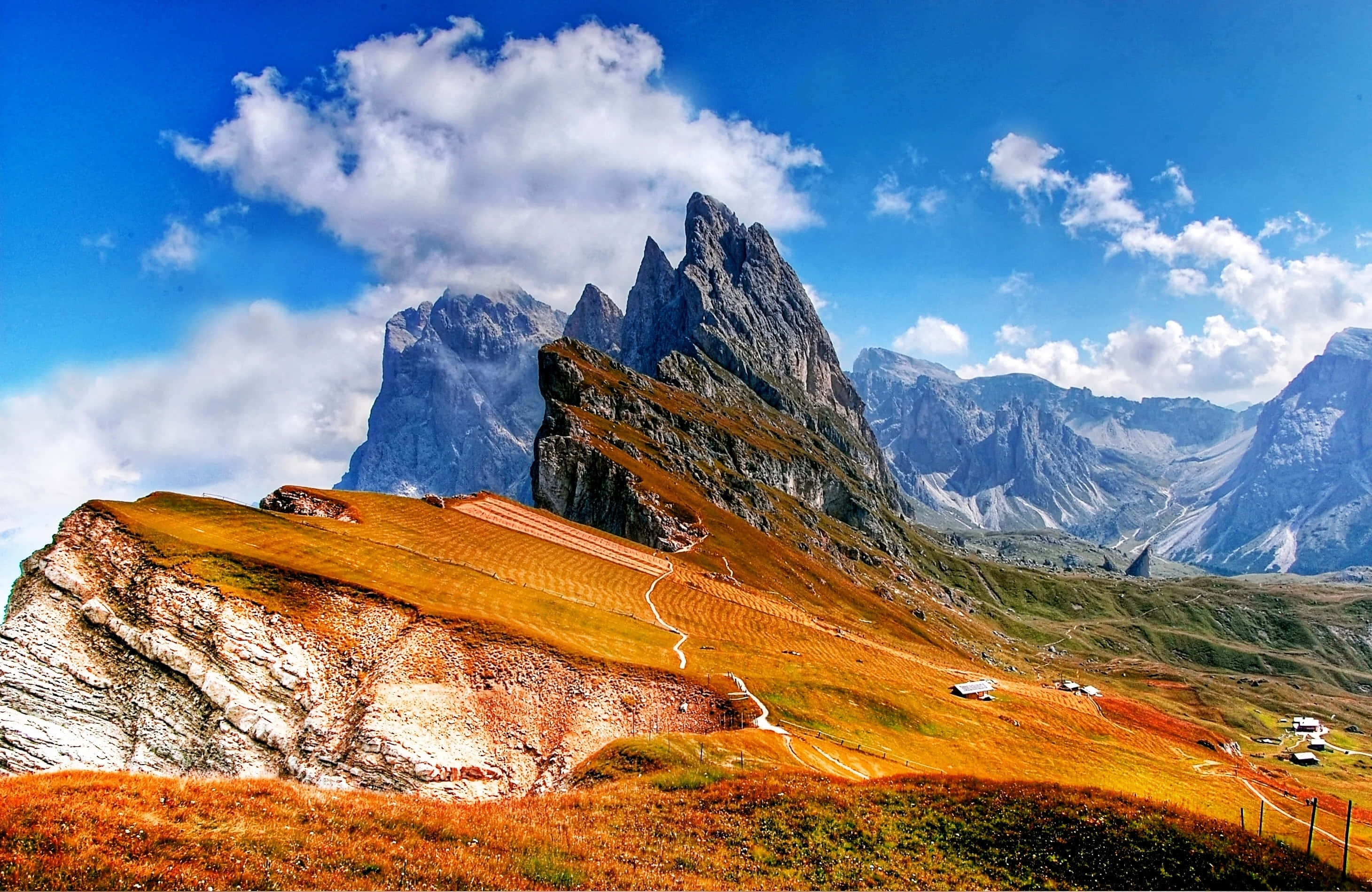 mountain peak, golden alpine meadows, bright blue sky, 2K Desktop Wallpaper