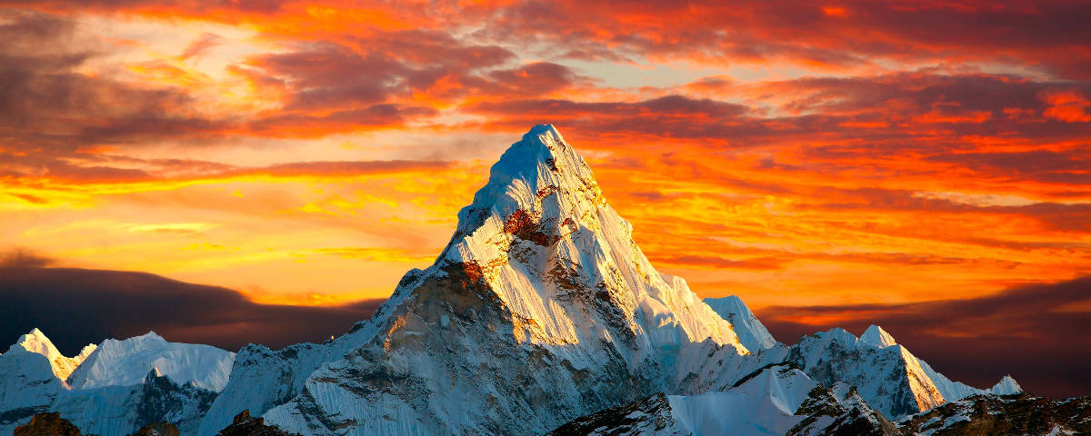snowy mountain peak, fiery orange and red sunset sky, dramatic cloud formations, SD Desktop Wallpaper