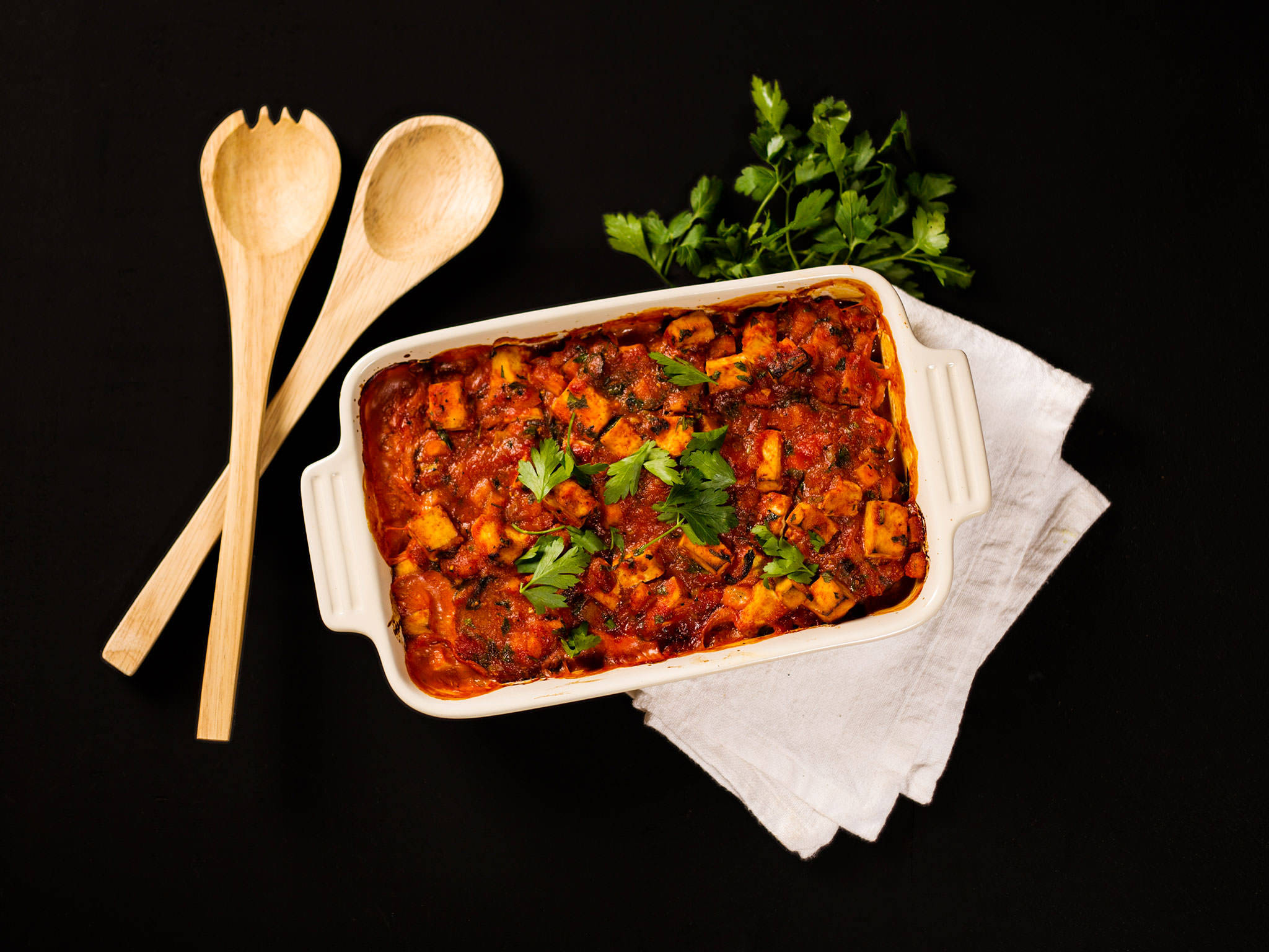 white ceramic baking dish, rich red tomato-based stew, fresh parsley, Full HD Desktop Wallpaper