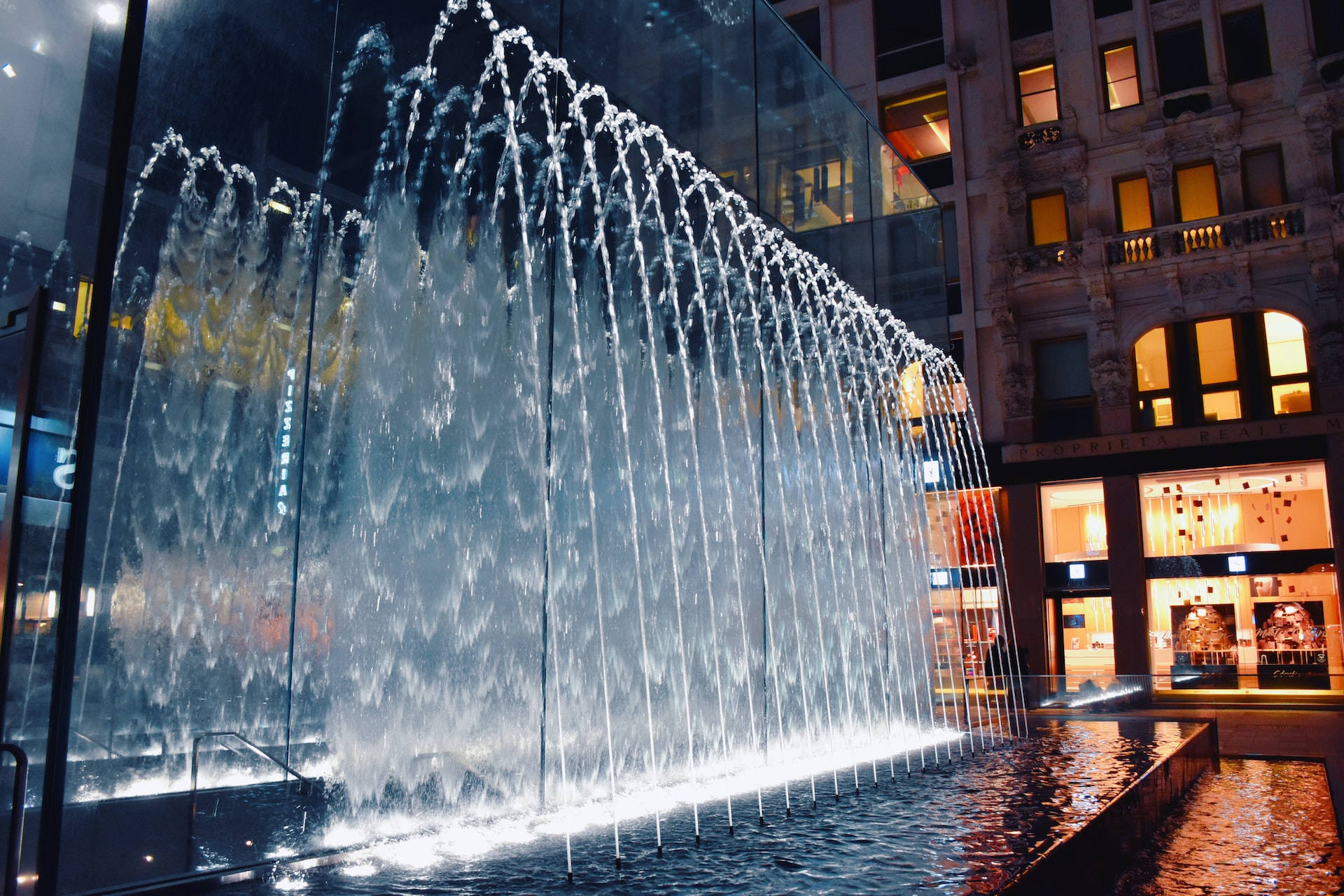 Spiral fountains of moving water, cascading waterfall fountain, modern urban plaza, Full HD Desktop Wallpaper