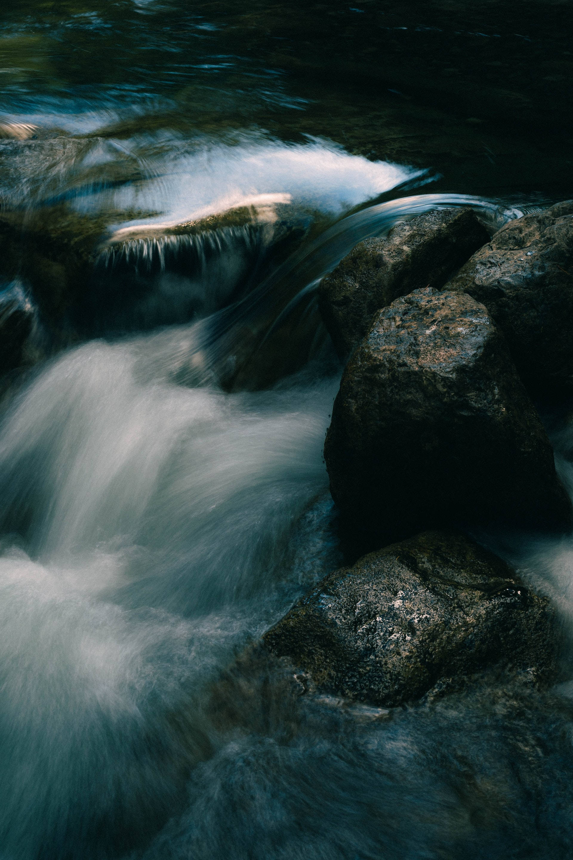 stream of moving water, slow-motion waterfall, mossy rocks, 2K Phone Wallpaper