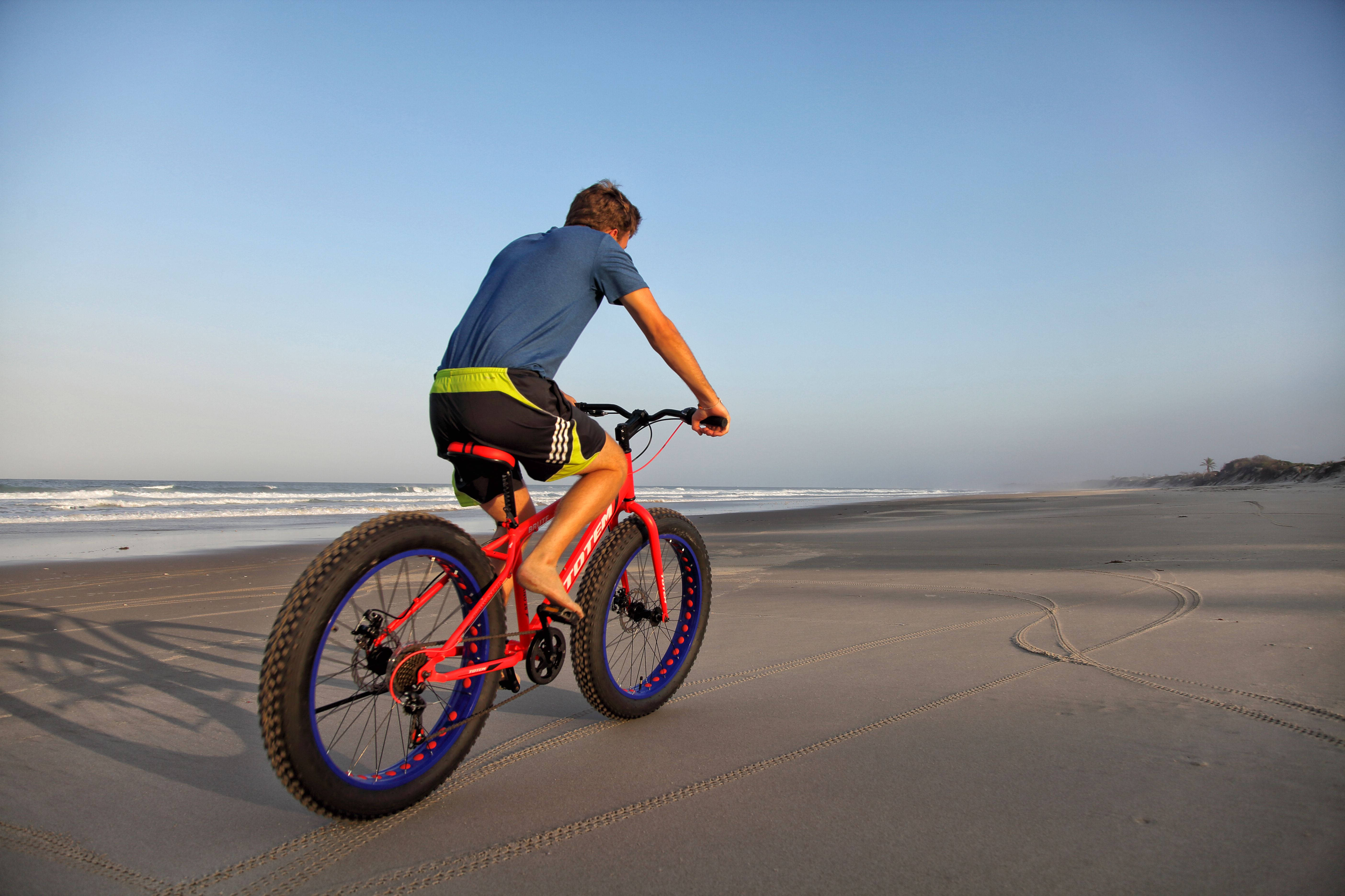 Mozambique, bright red fatbike, sandy beach, 5K Desktop Wallpaper