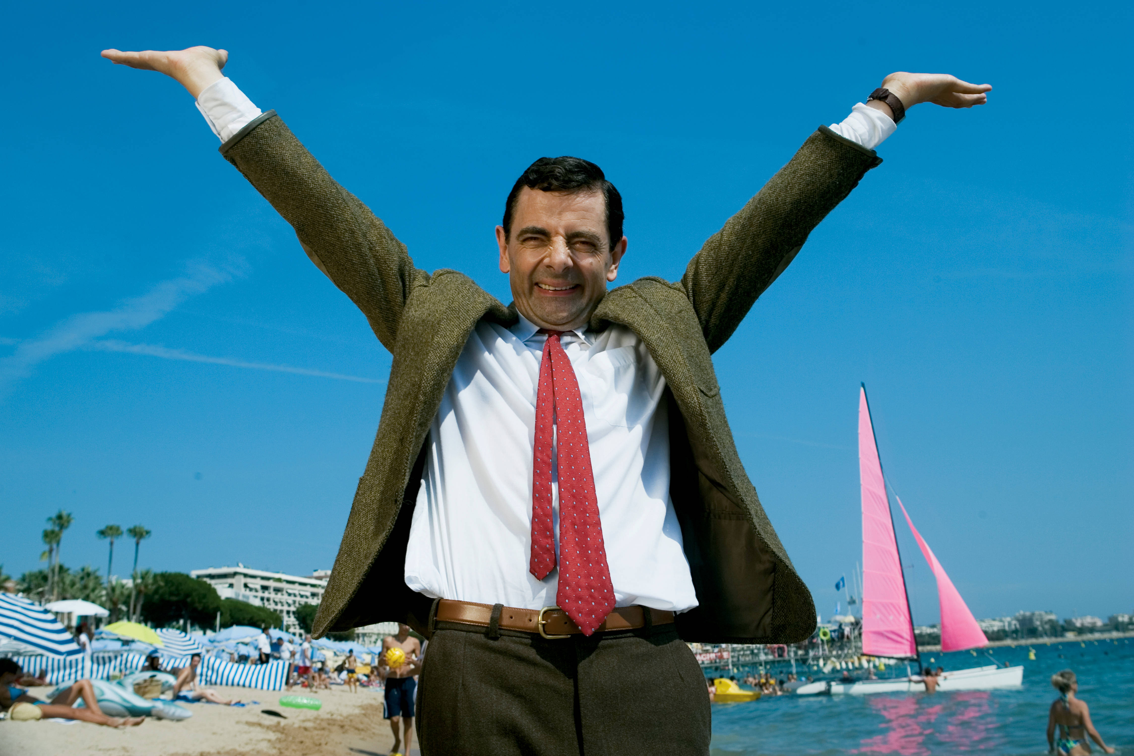 Mr Bean, sunlit beach, vivid blue sky, 4K Desktop Wallpaper