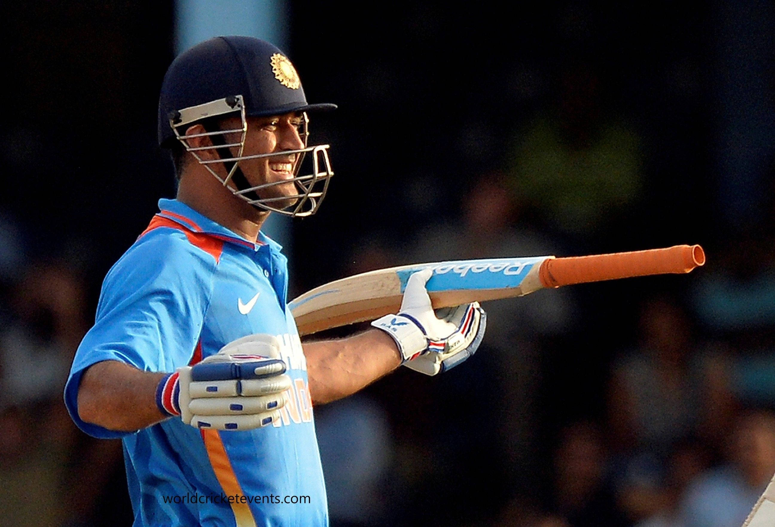 MS Dhoni, blue uniform, bat, 2K Desktop Wallpaper