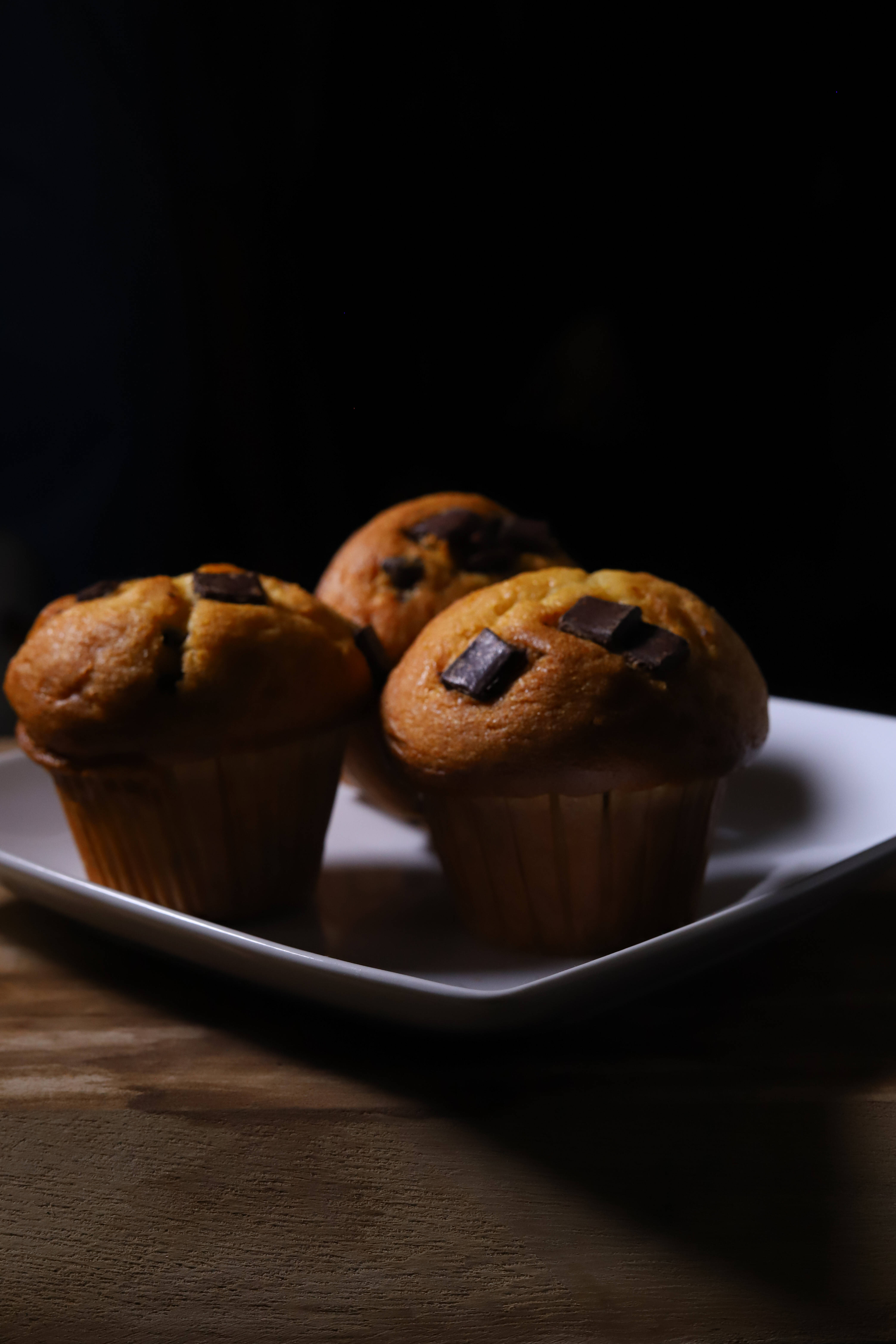 three fluffy muffins, golden chocolate chip muffins, white plate, 5K Phone Wallpaper