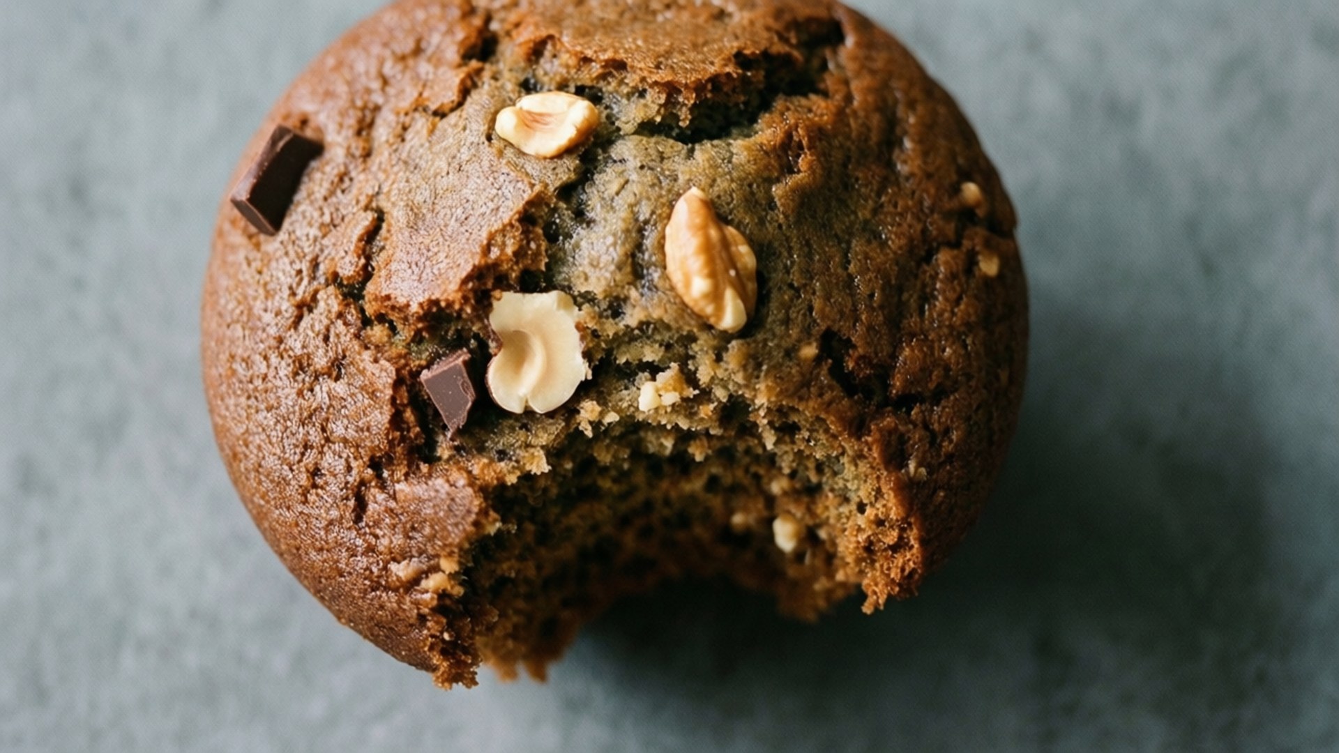chocolate chip walnut muffin, gray surface, bitten, Full HD Desktop Wallpaper