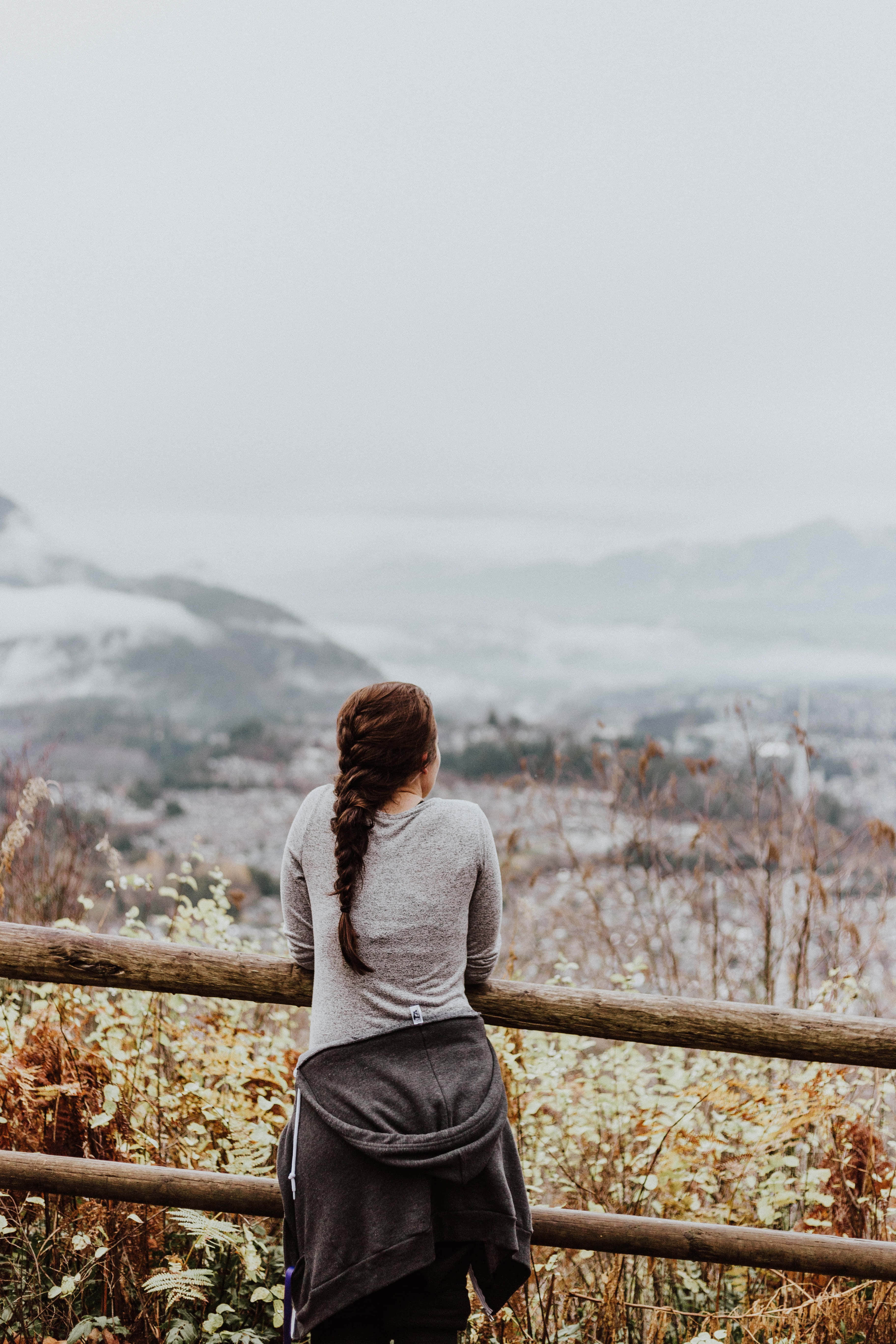 mujer soltera, long braid, wooden railing, 5K Phone Wallpaper