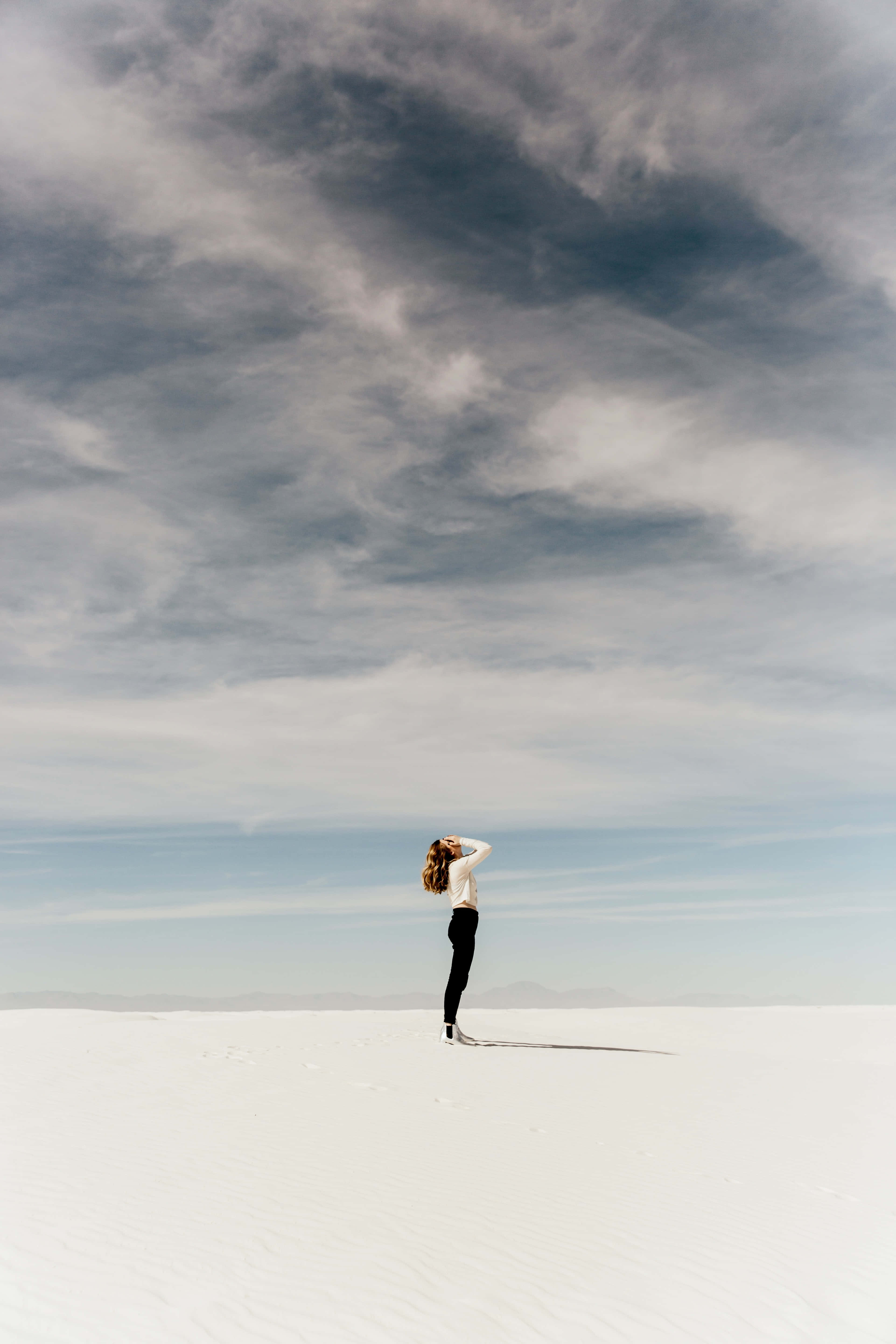 Mujer Soltera, white desert, dramatic cloudy sky, 5K Phone Wallpaper