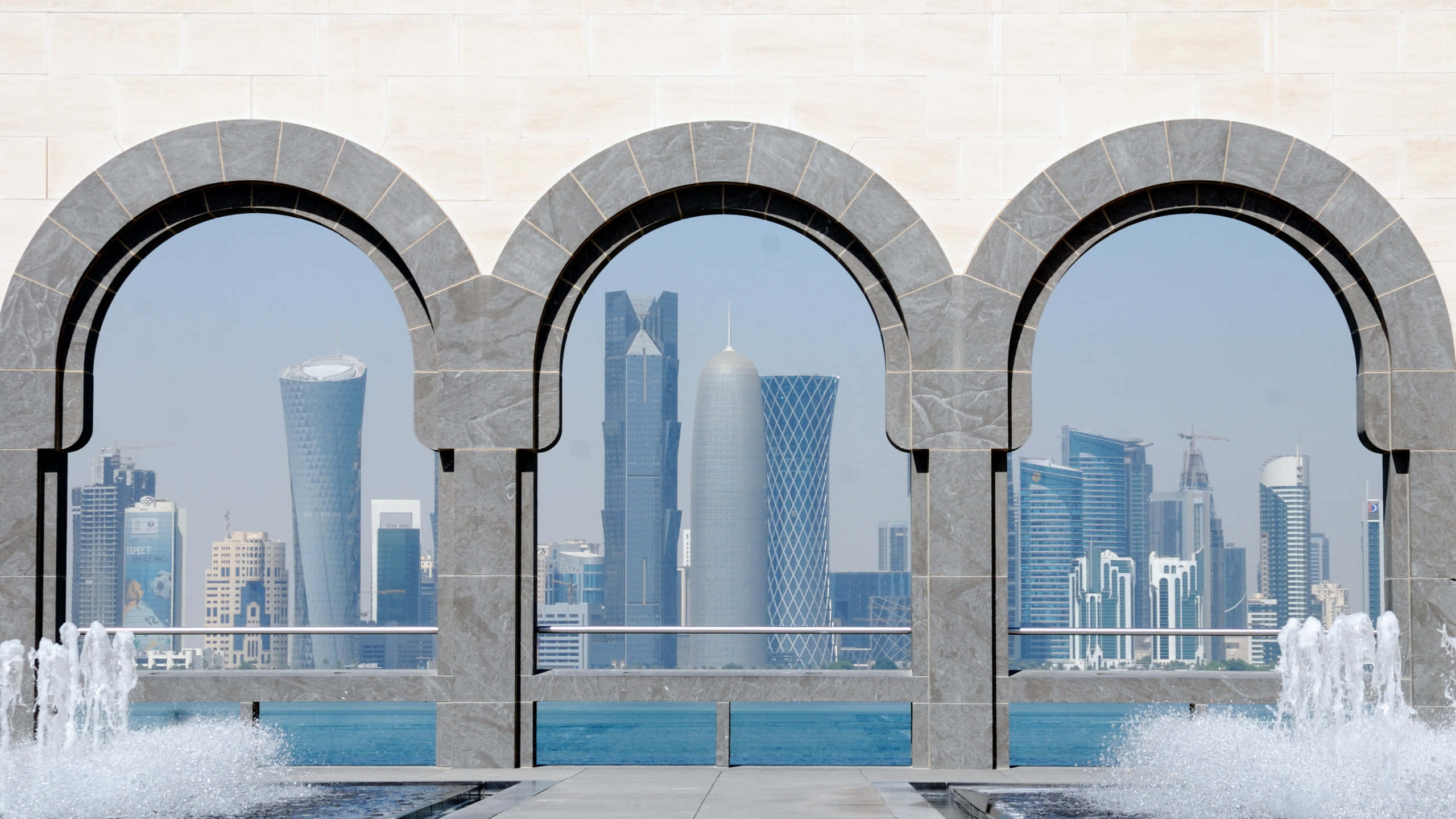 Museum Of Islamic Art, stone arches, modern city skyline, 2K Desktop Wallpaper