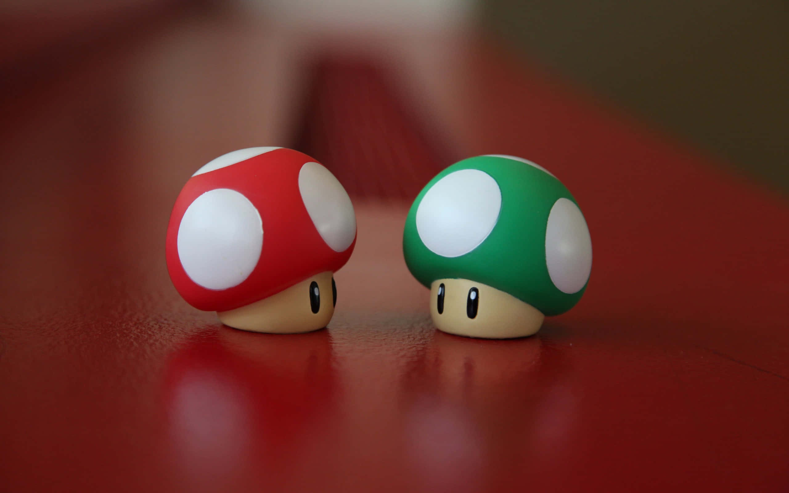kawaii mushroom, red and green mushroom figurines, glossy red surface, 2K Desktop Wallpaper