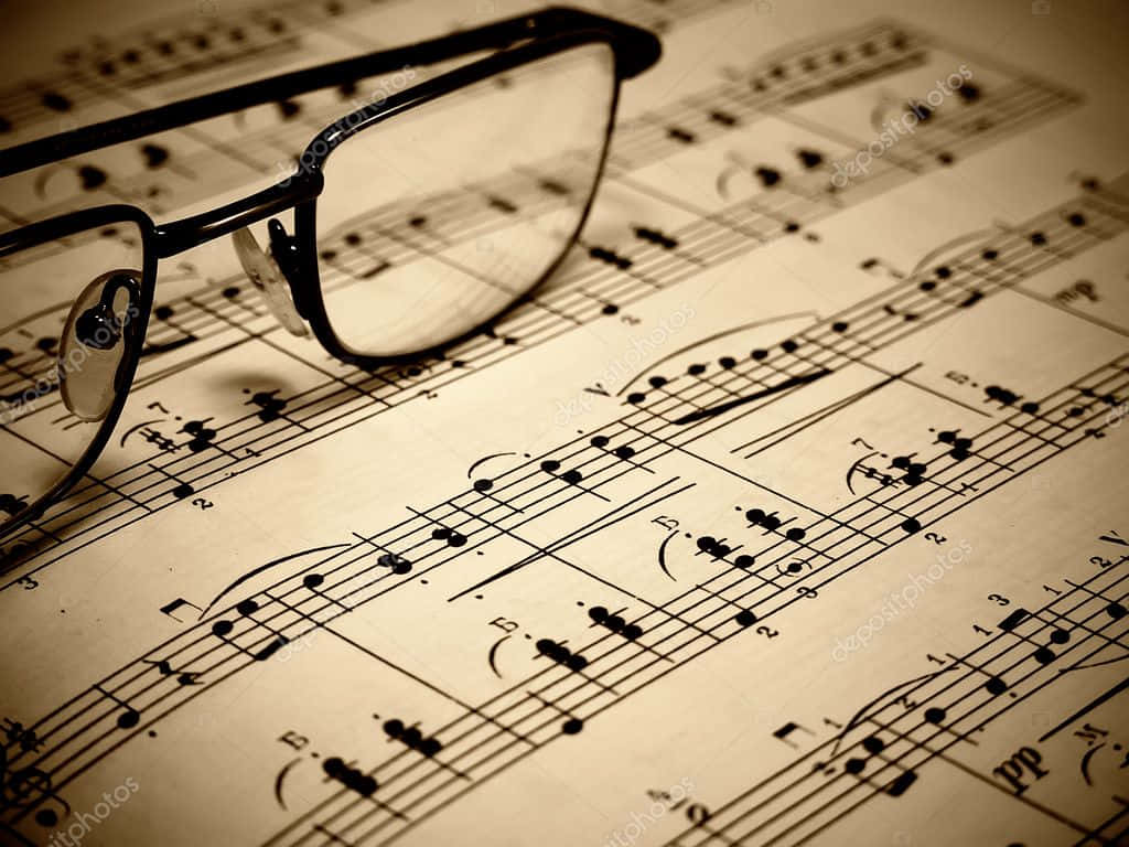 black-framed glasses, vintage sepia-toned sheet music, musical notes, SD Desktop Wallpaper