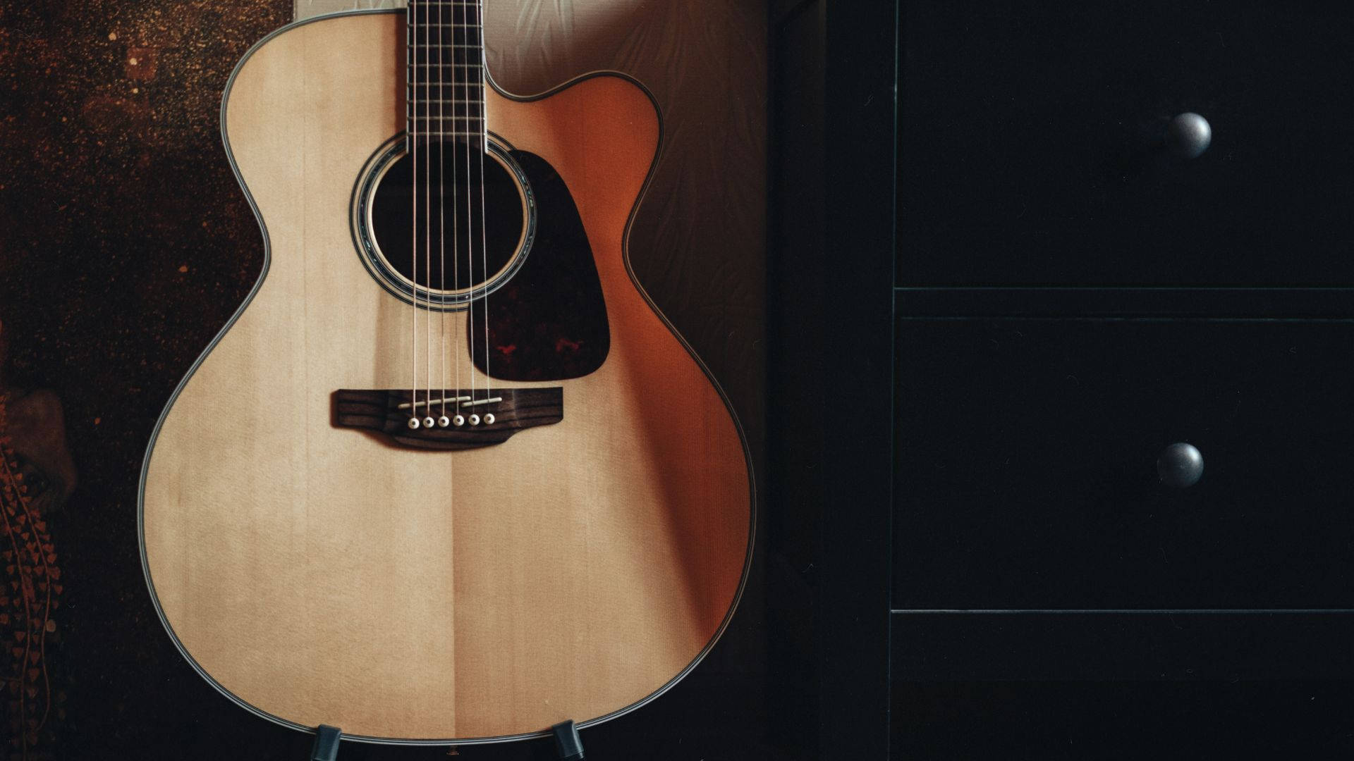 acoustic guitar, light brown body, dark wooden wall, Full HD Desktop Wallpaper