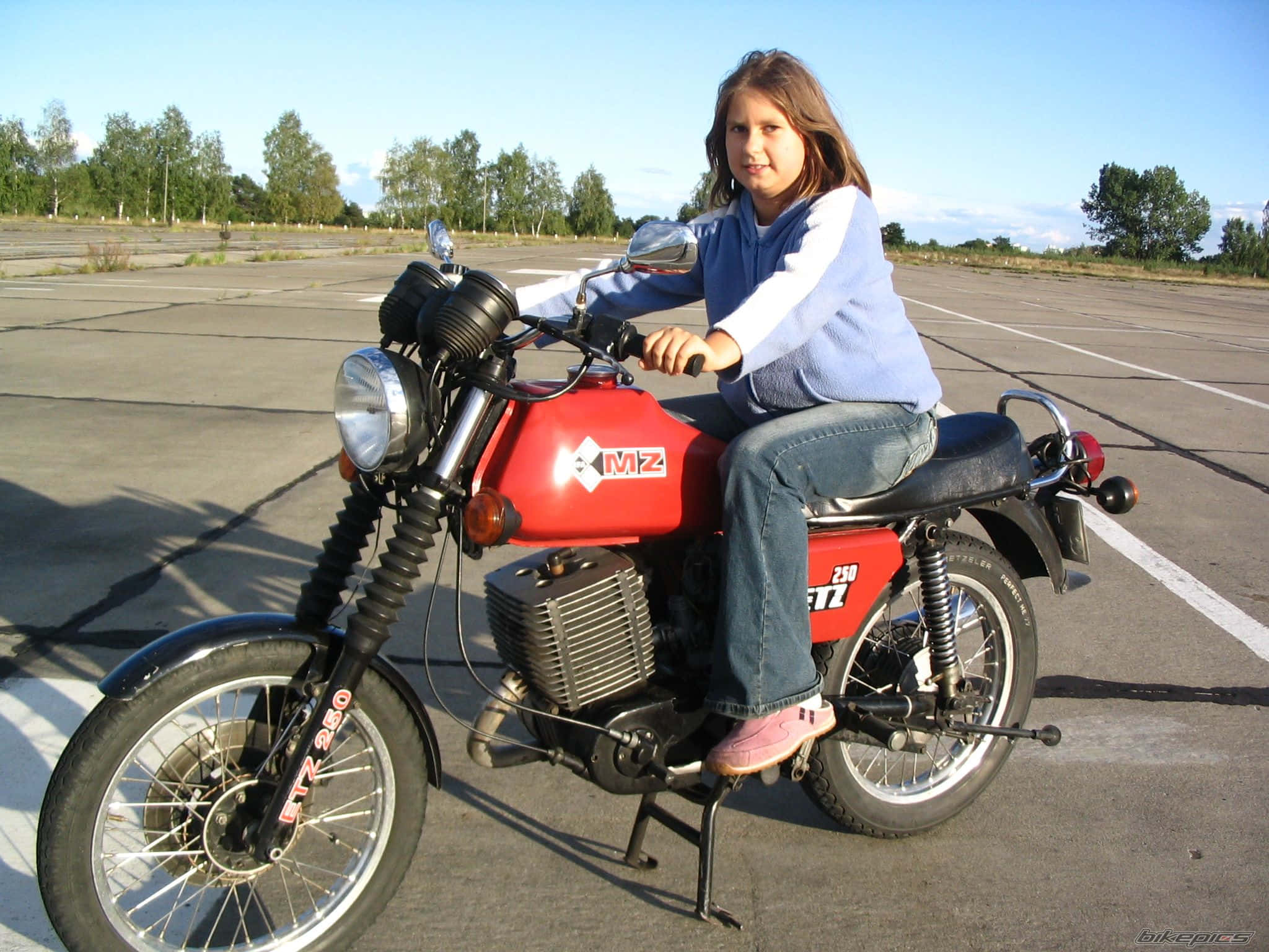young girl, red vintage motorcycle, paved parking lot, Full HD Desktop Wallpaper