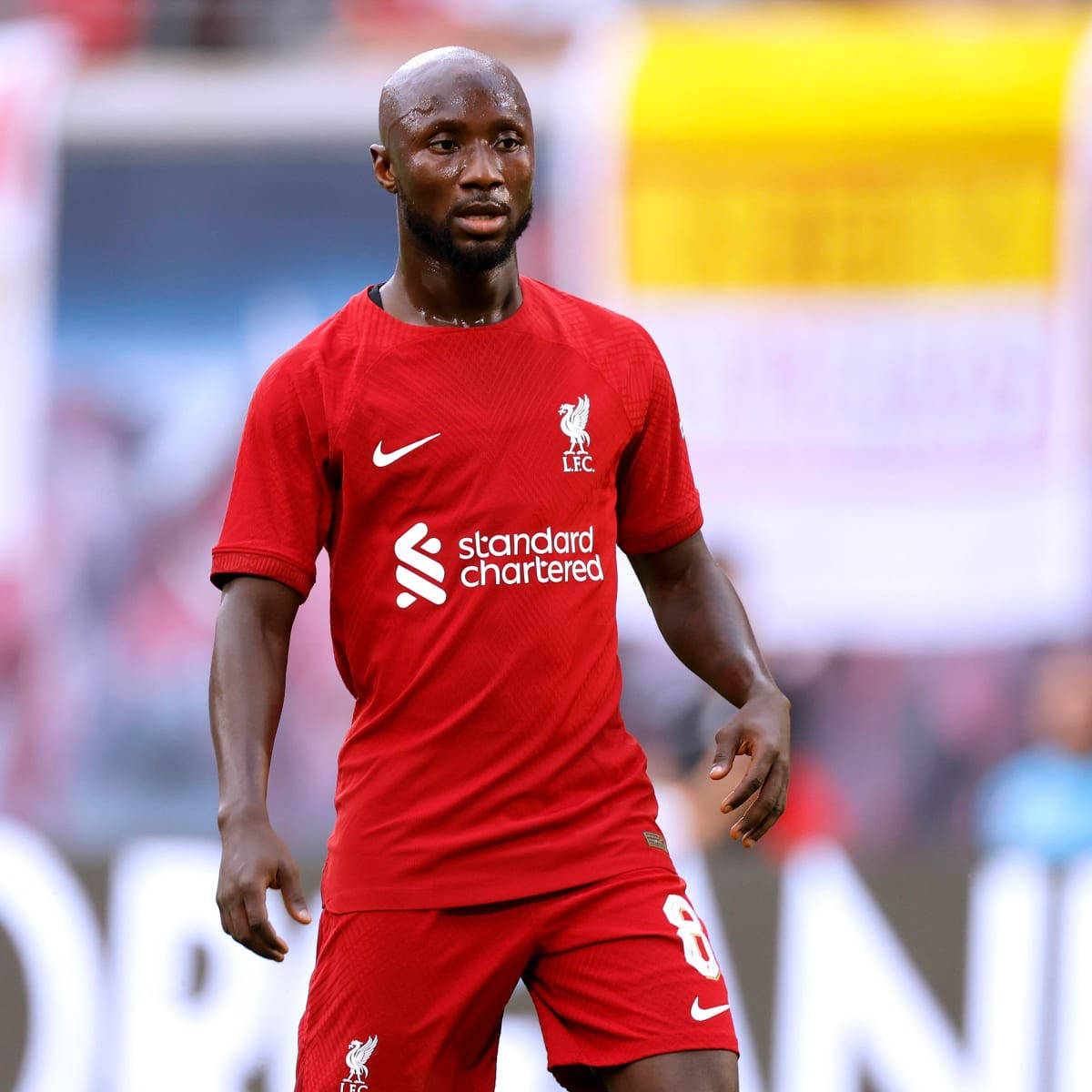 Naby Keita, red Liverpool FC jersey, sunlit field, SD Desktop Wallpaper