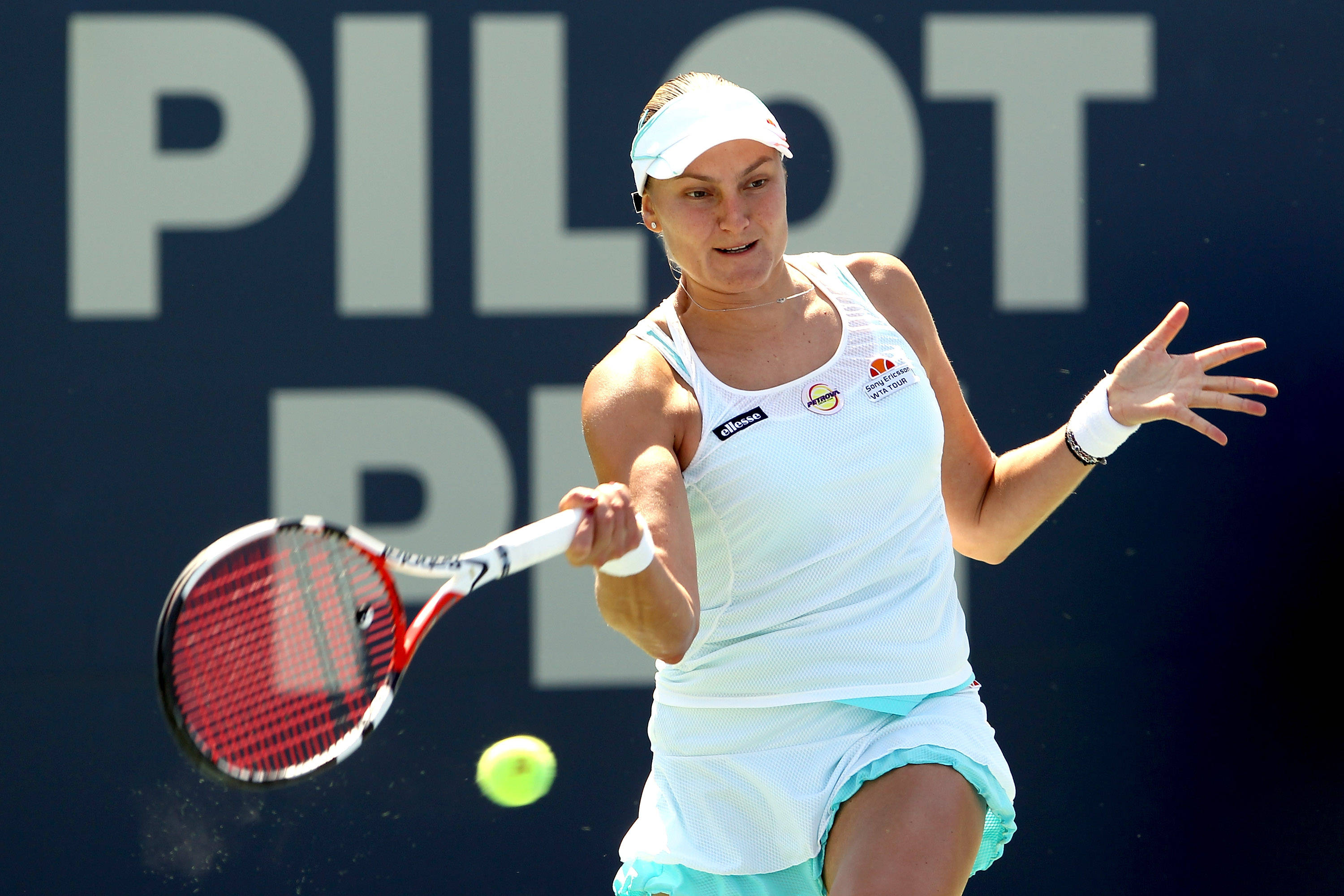 Nadia Petrova, stable forehand stroke, white and teal gear, 2K Desktop Wallpaper