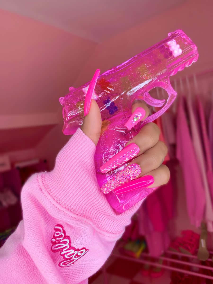 glittery pink nails, translucent pink toy gun, monochromatic pink room, SD Phone Wallpaper