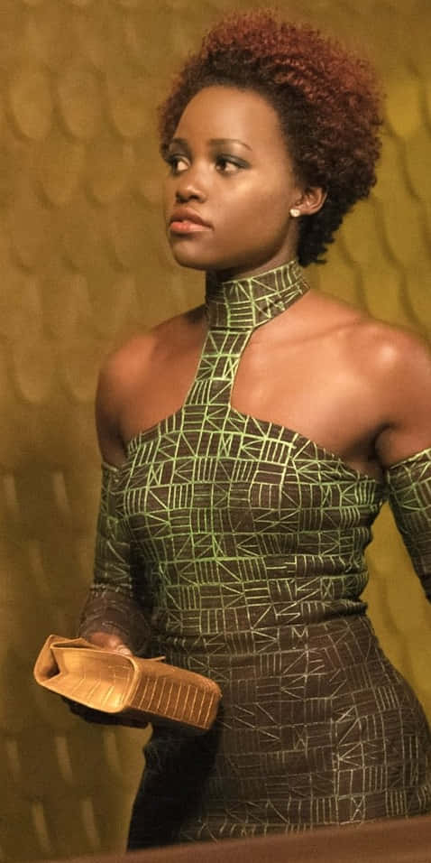 Nakia, green patterned dress, gold clutch, SD Phone Wallpaper