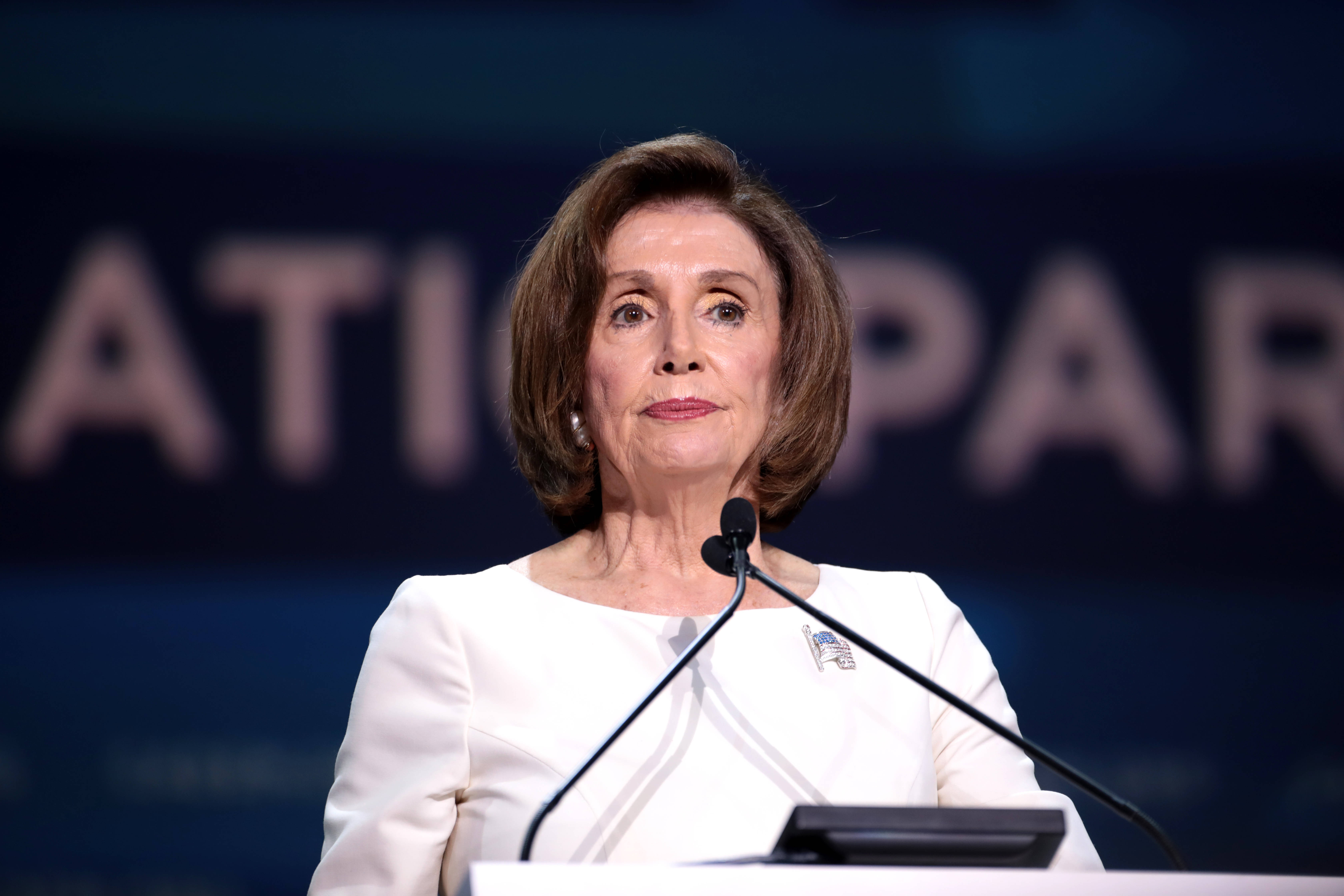 Nancy Pelosi, podium, dark blue backdrop, 5K Desktop Wallpaper