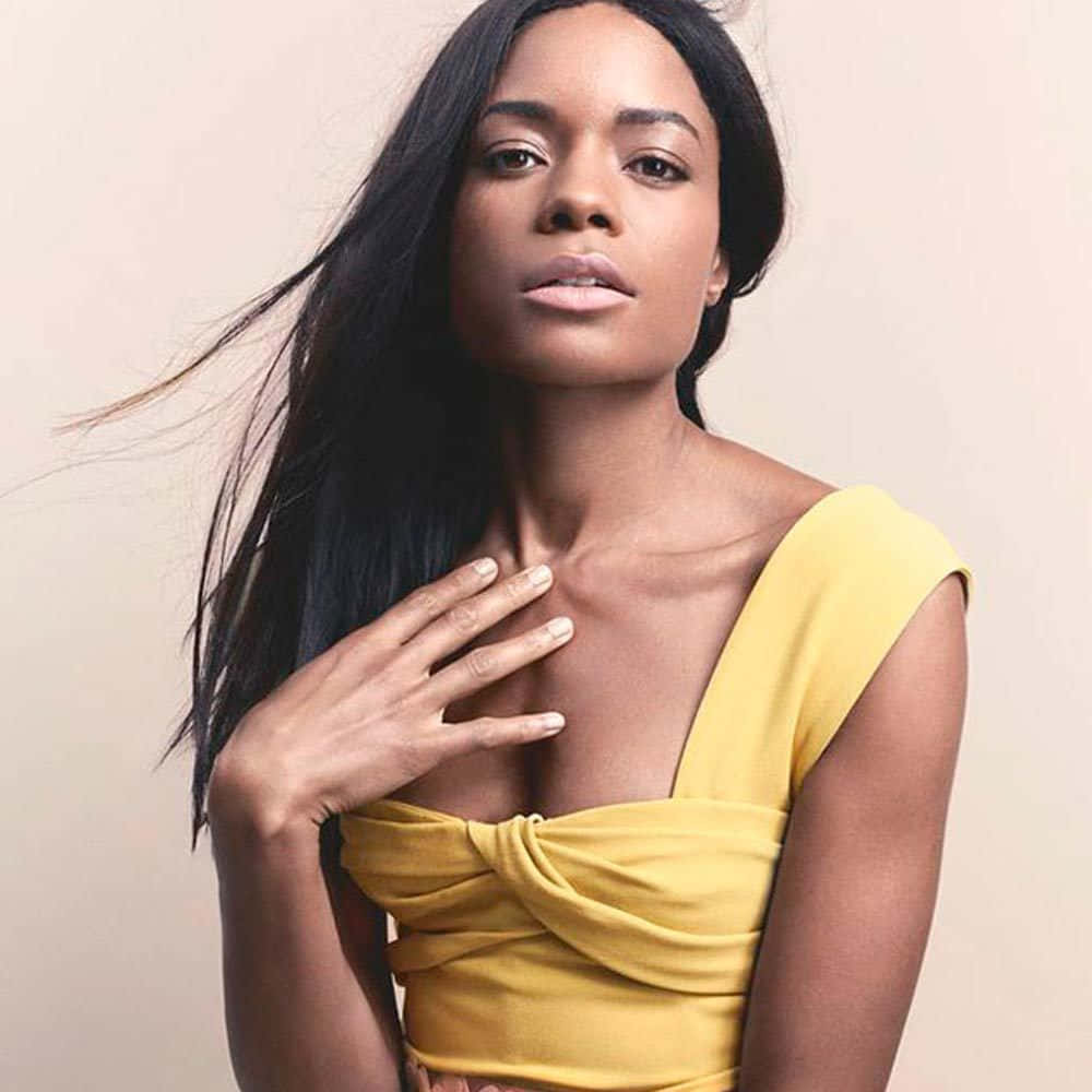Naomie Harris, vibrant yellow top, long dark hair, SD Desktop Wallpaper