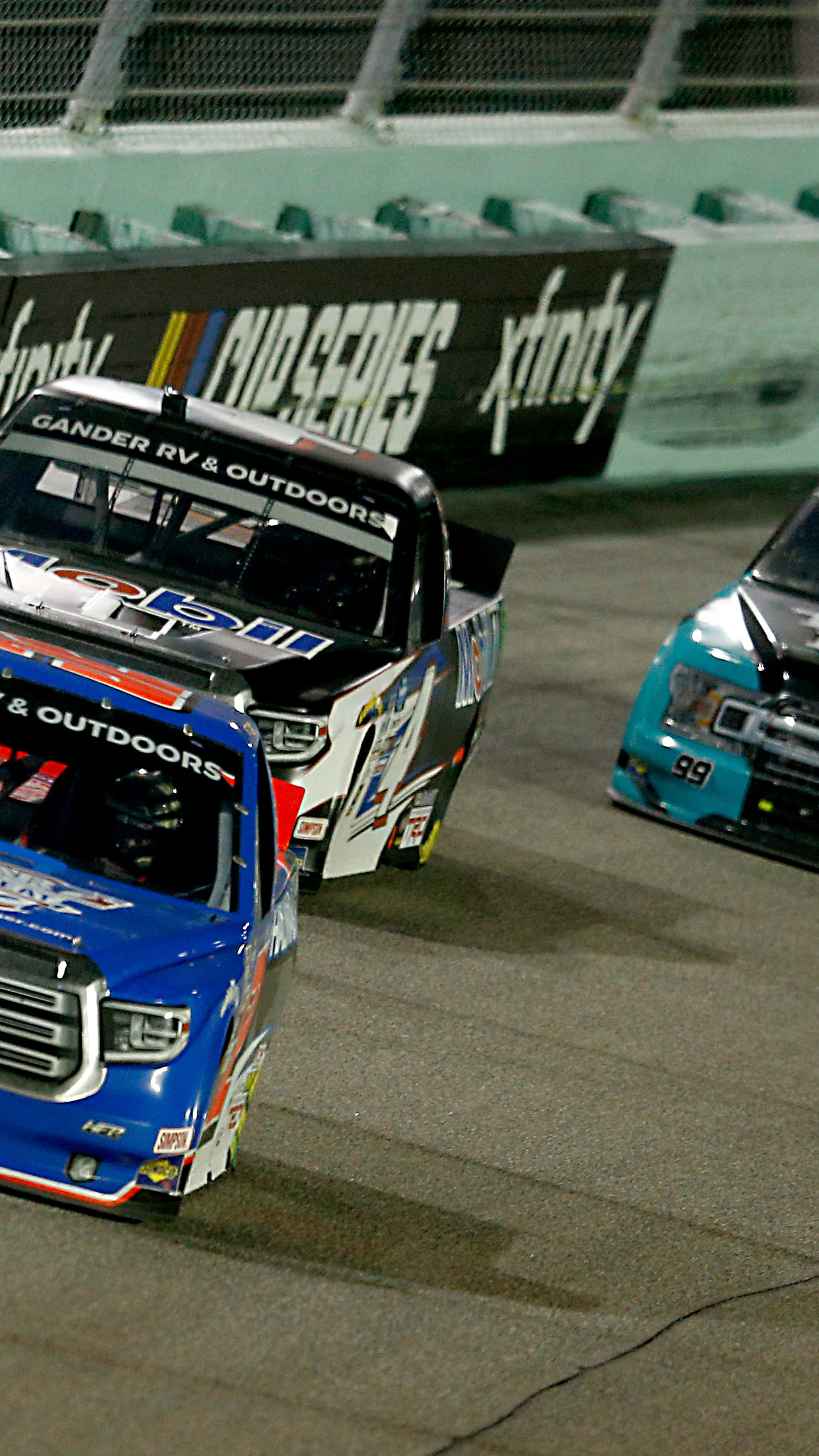 Nascar iPhone, racing trucks, nighttime asphalt track, 2K Phone Wallpaper