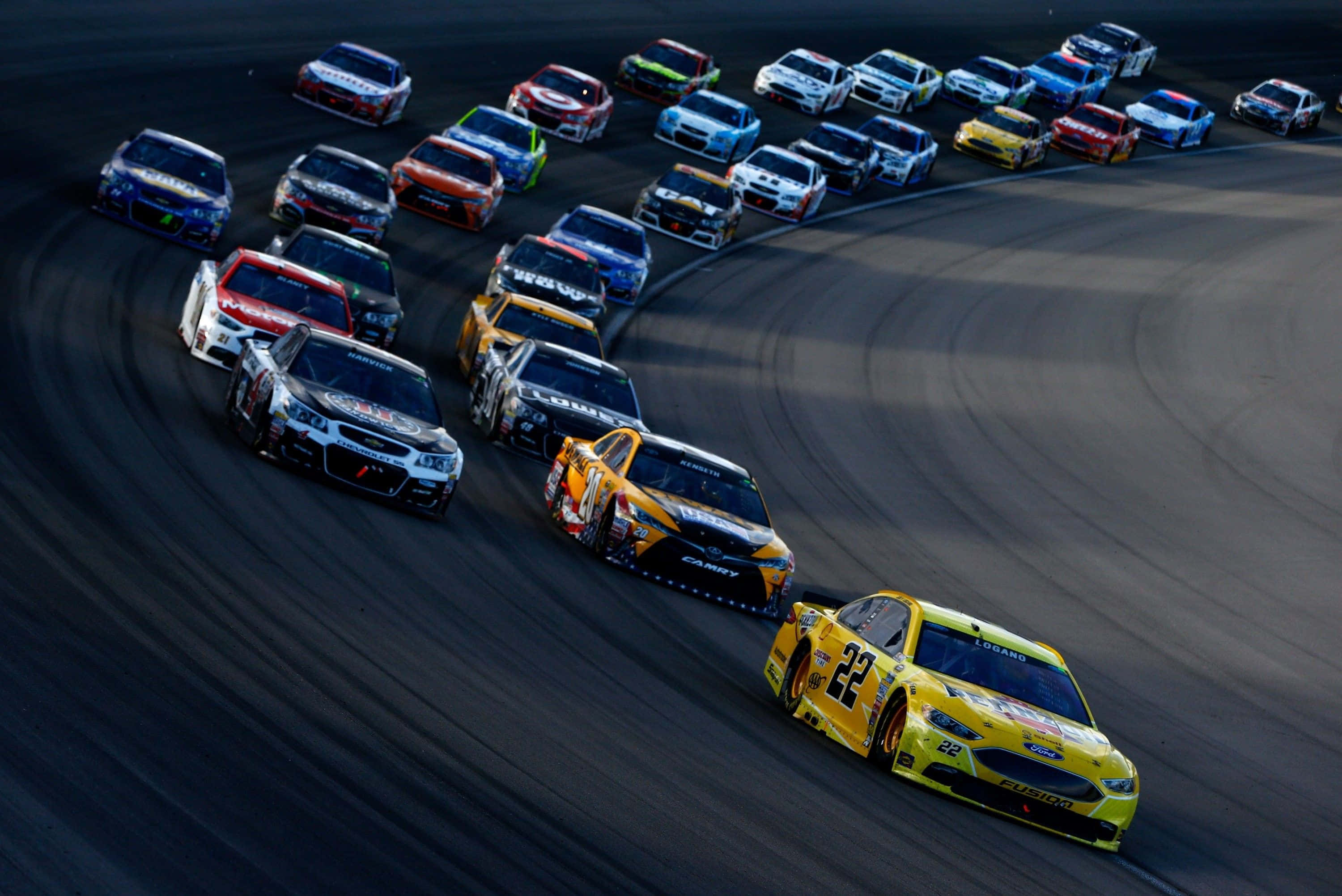 NASCAR, brightly colored cars, sweeping turn, 2K Desktop Wallpaper