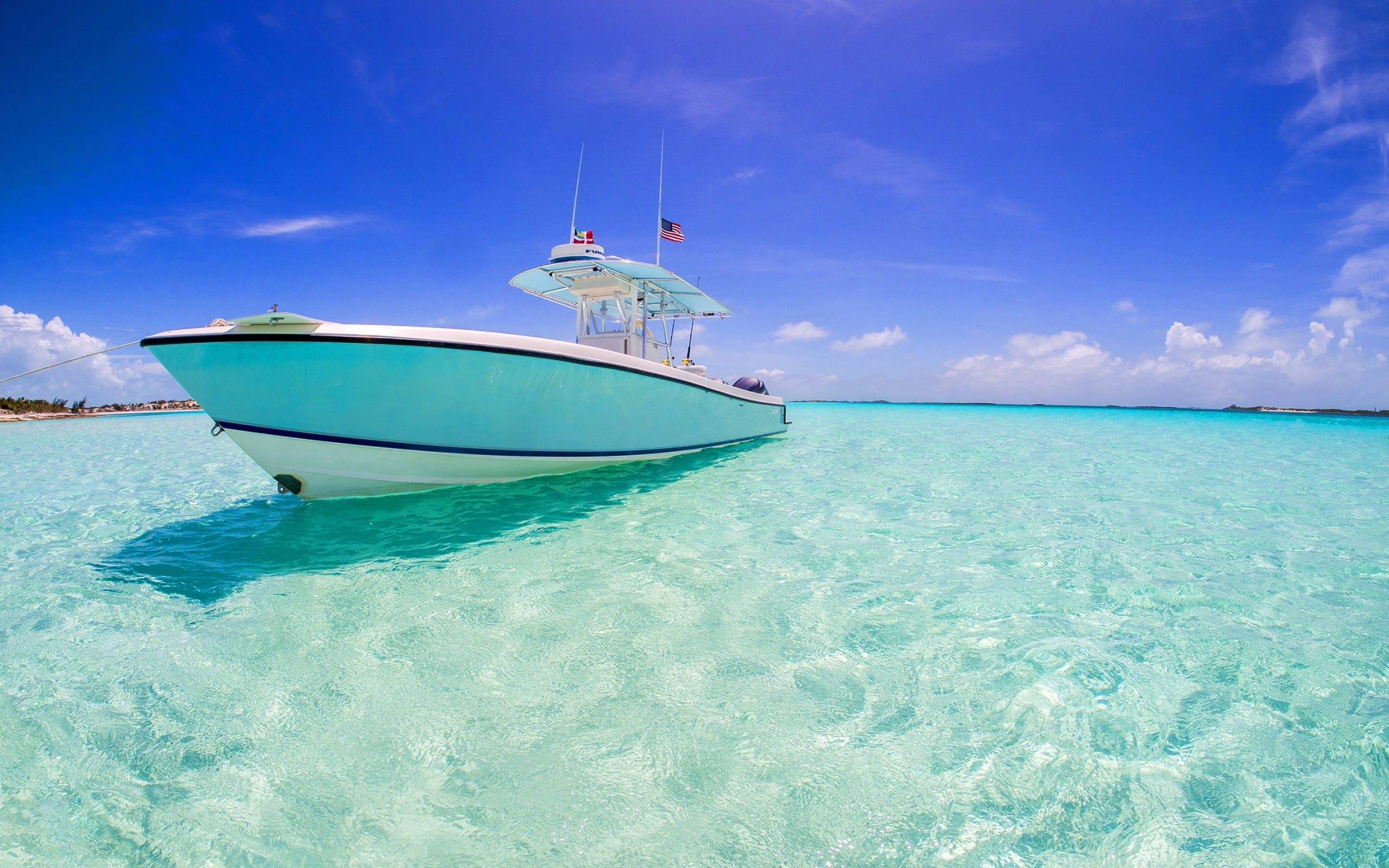 Nassau Bahamas, light blue fishing boat, crystal clear turquoise waters, 2K Desktop Wallpaper