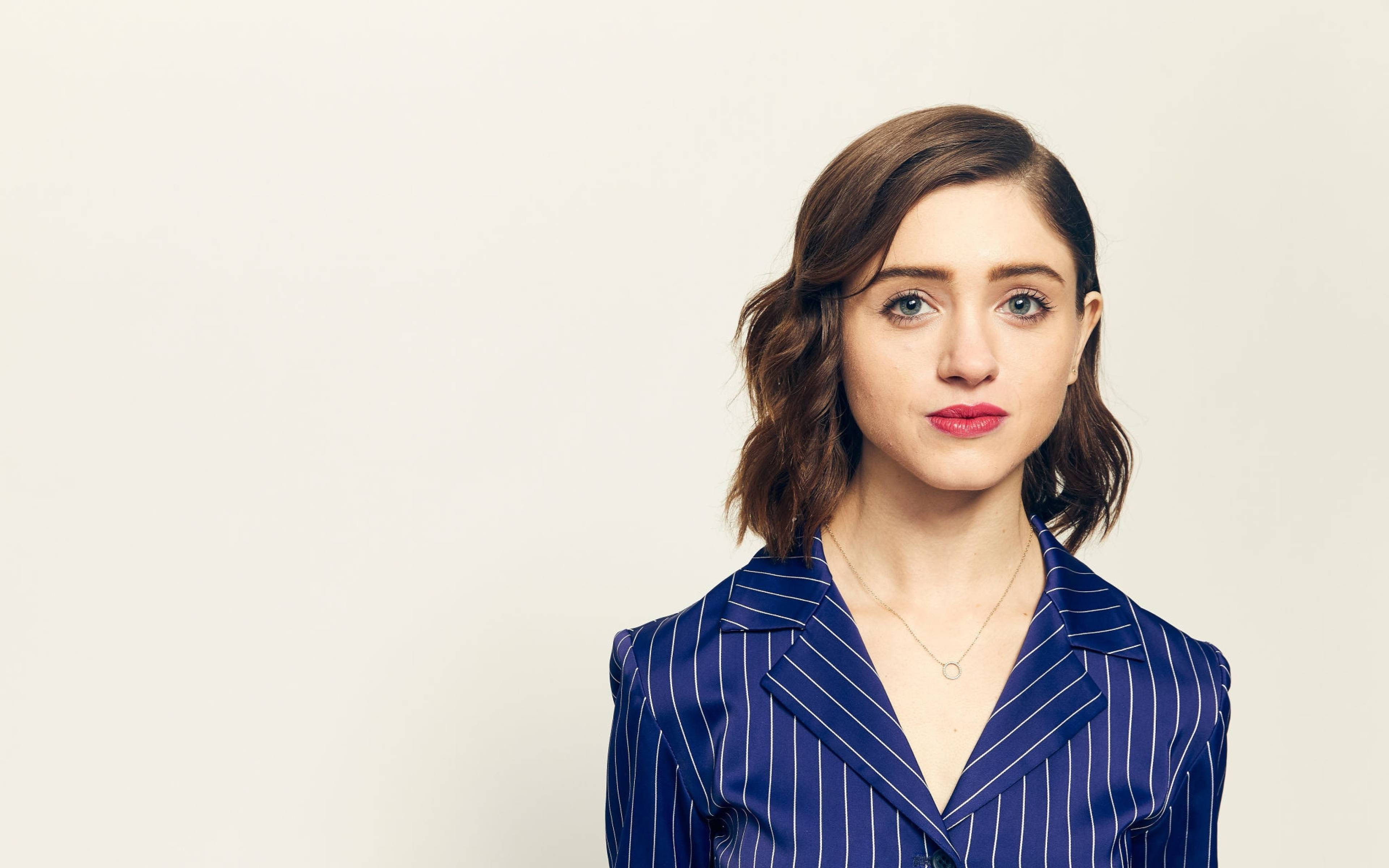 Natalia Dyer, blue pinstripe blazer, wavy brown hair, 4K Desktop Wallpaper