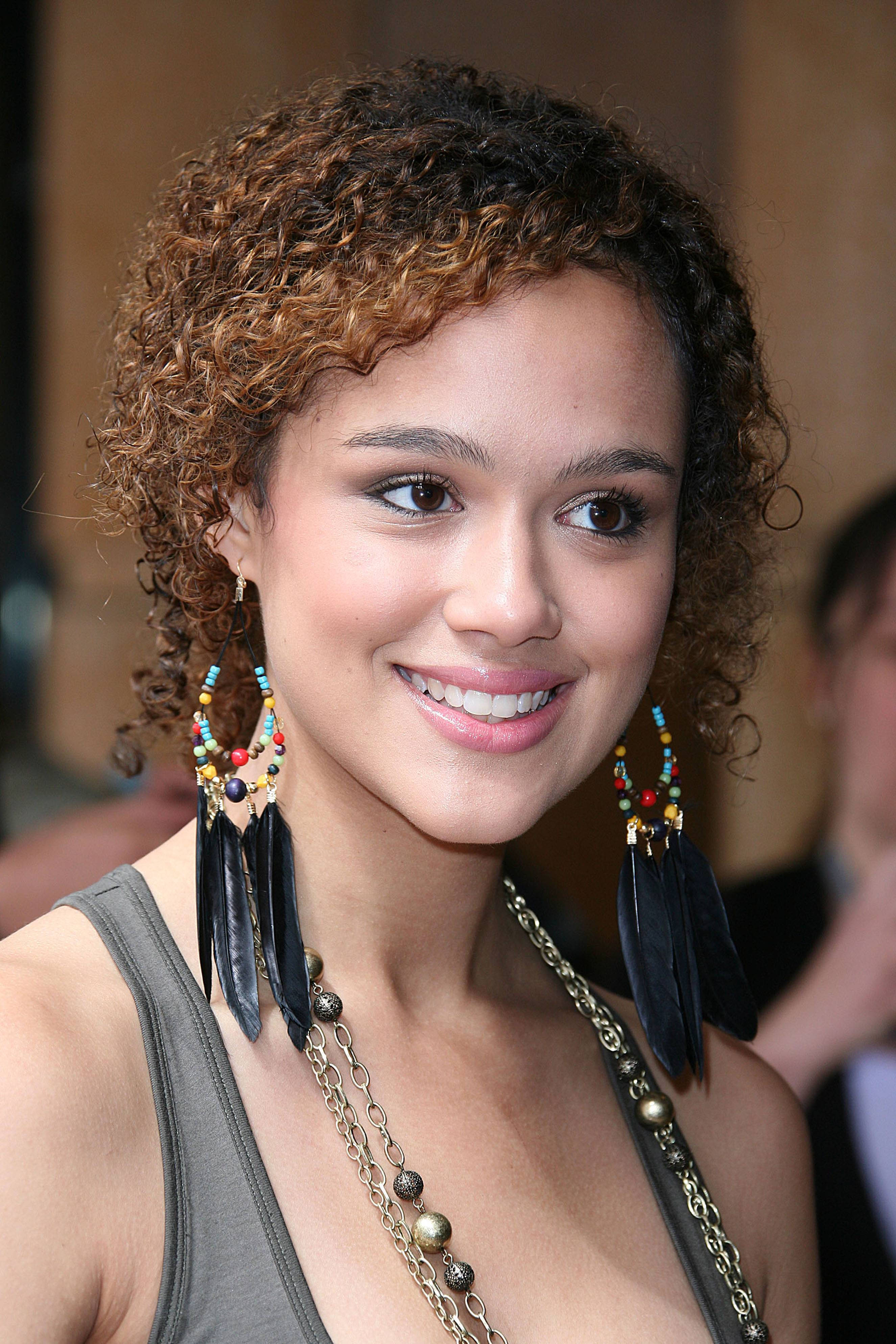 Nathalie Emmanuel, curly brown hair, colorful beaded feather earrings, 4K Phone Wallpaper