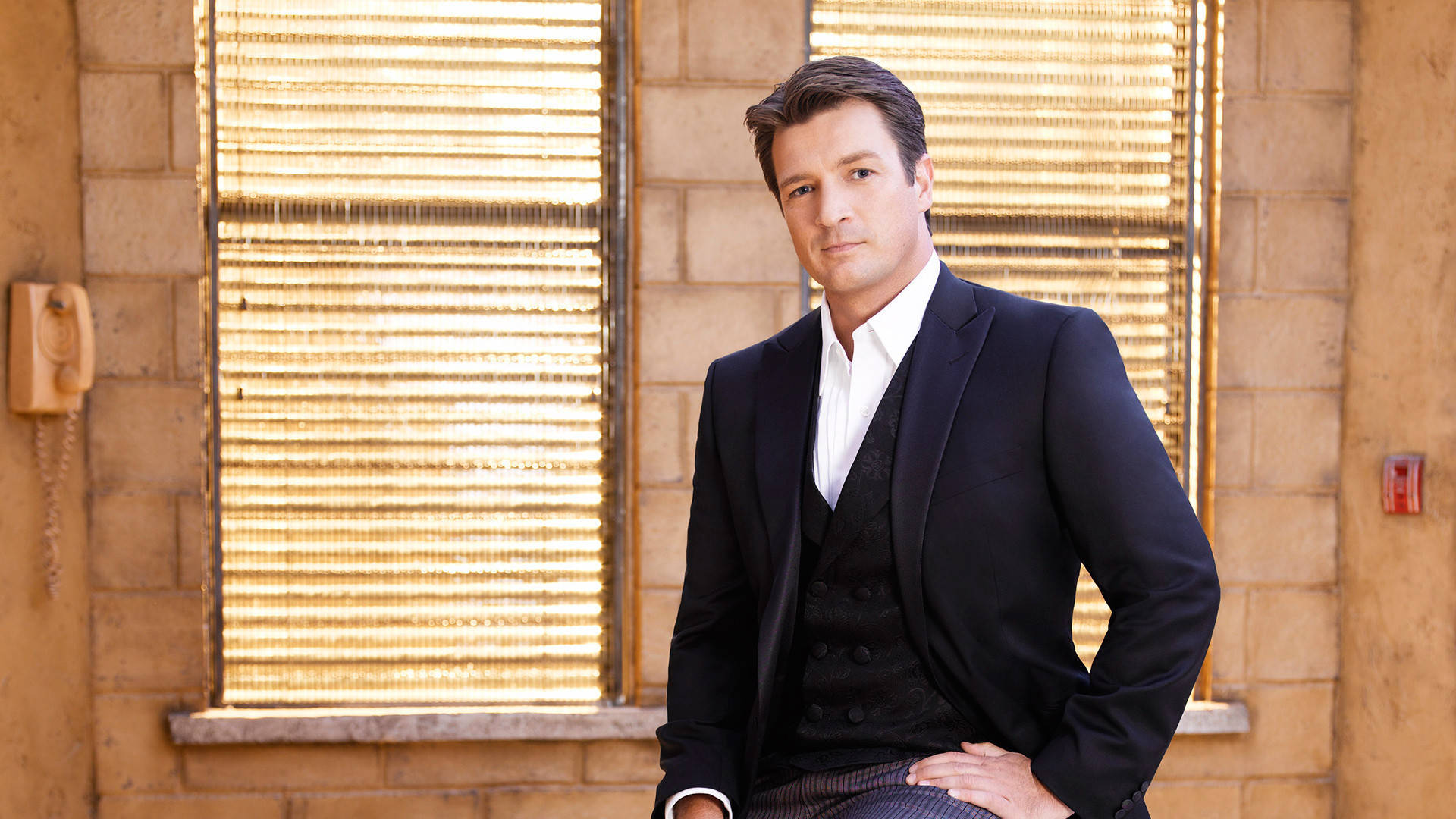 Nathan Fillion, black suit, sunlit brick wall, Full HD Desktop Wallpaper