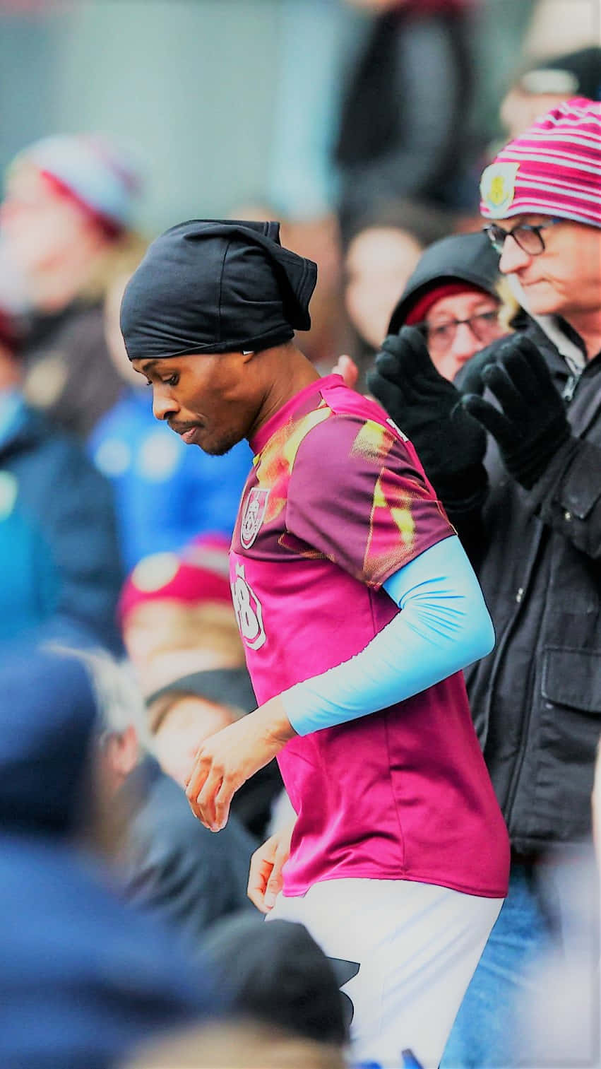 Nathan Tella, vibrant pink and purple jersey, stadium crowd, HD Phone Wallpaper
