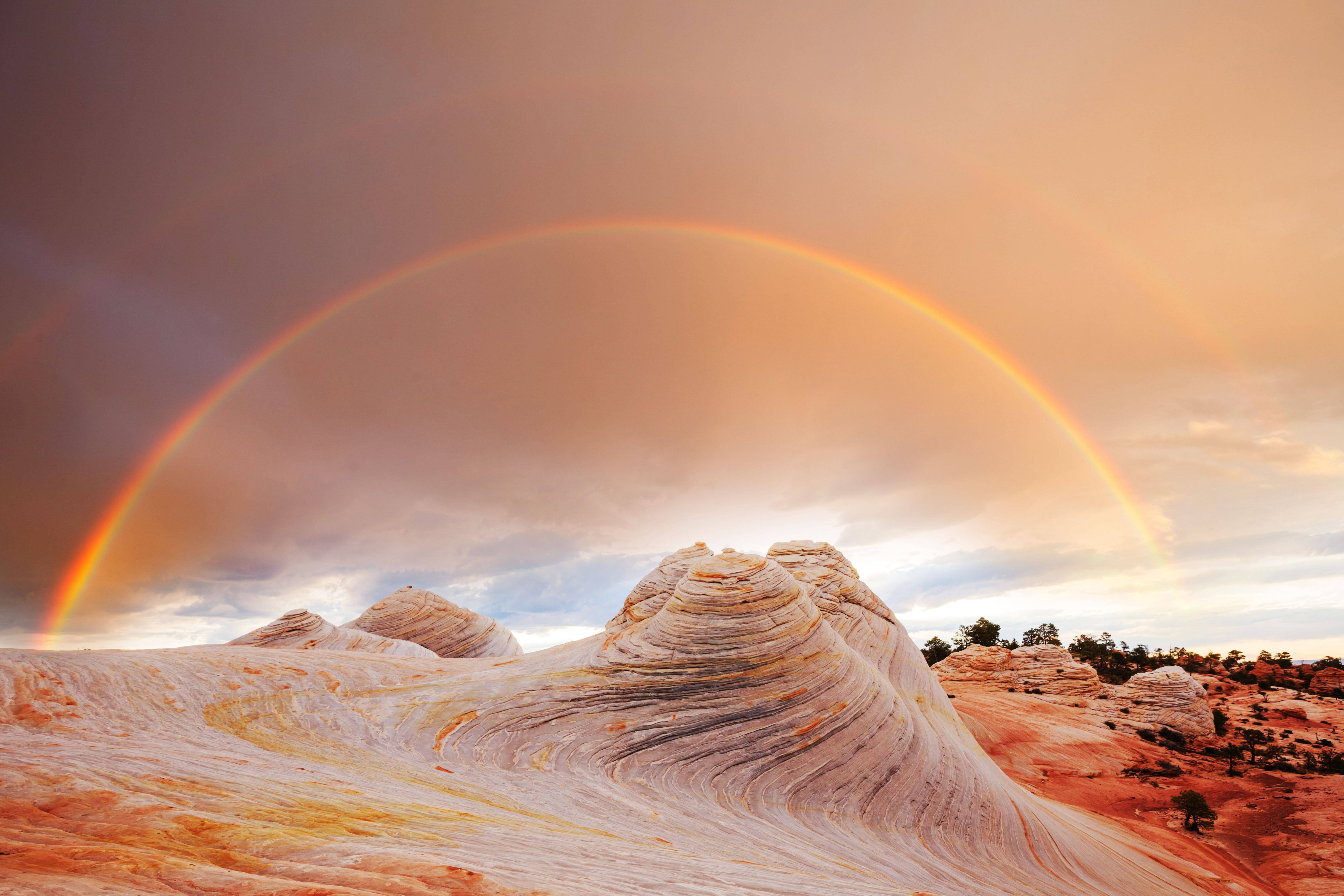 double rainbow, surreal wave-like rock formations, desert, 5K Desktop Wallpaper