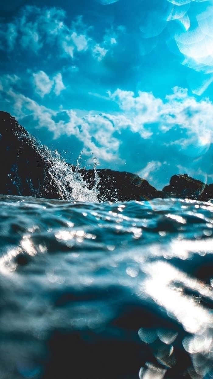 Blue Ocean, ocean waves, dark rocks, SD Phone Wallpaper