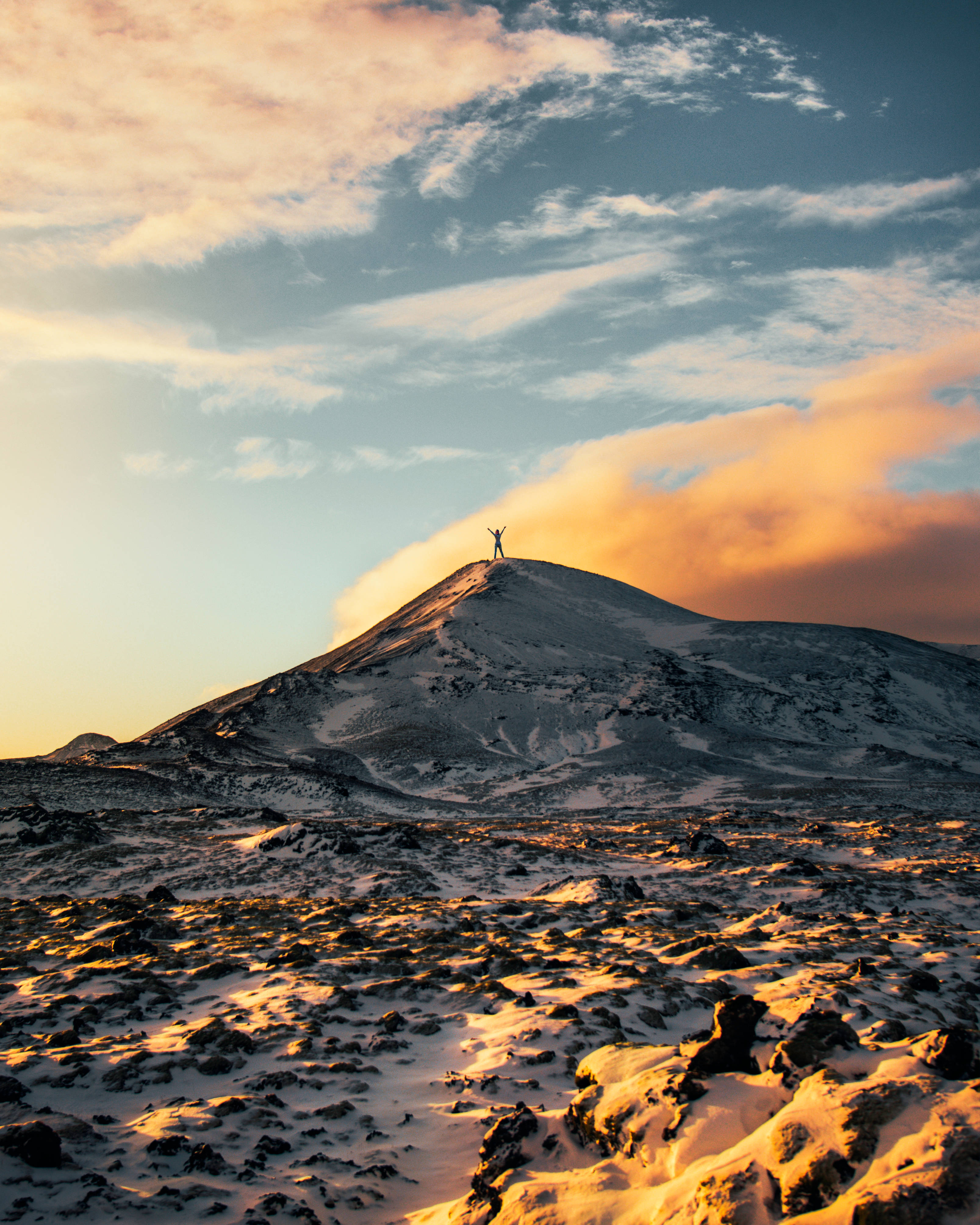 man on a hill, snow-dusted volcanic mountain, golden sunset, 4K Phone Wallpaper