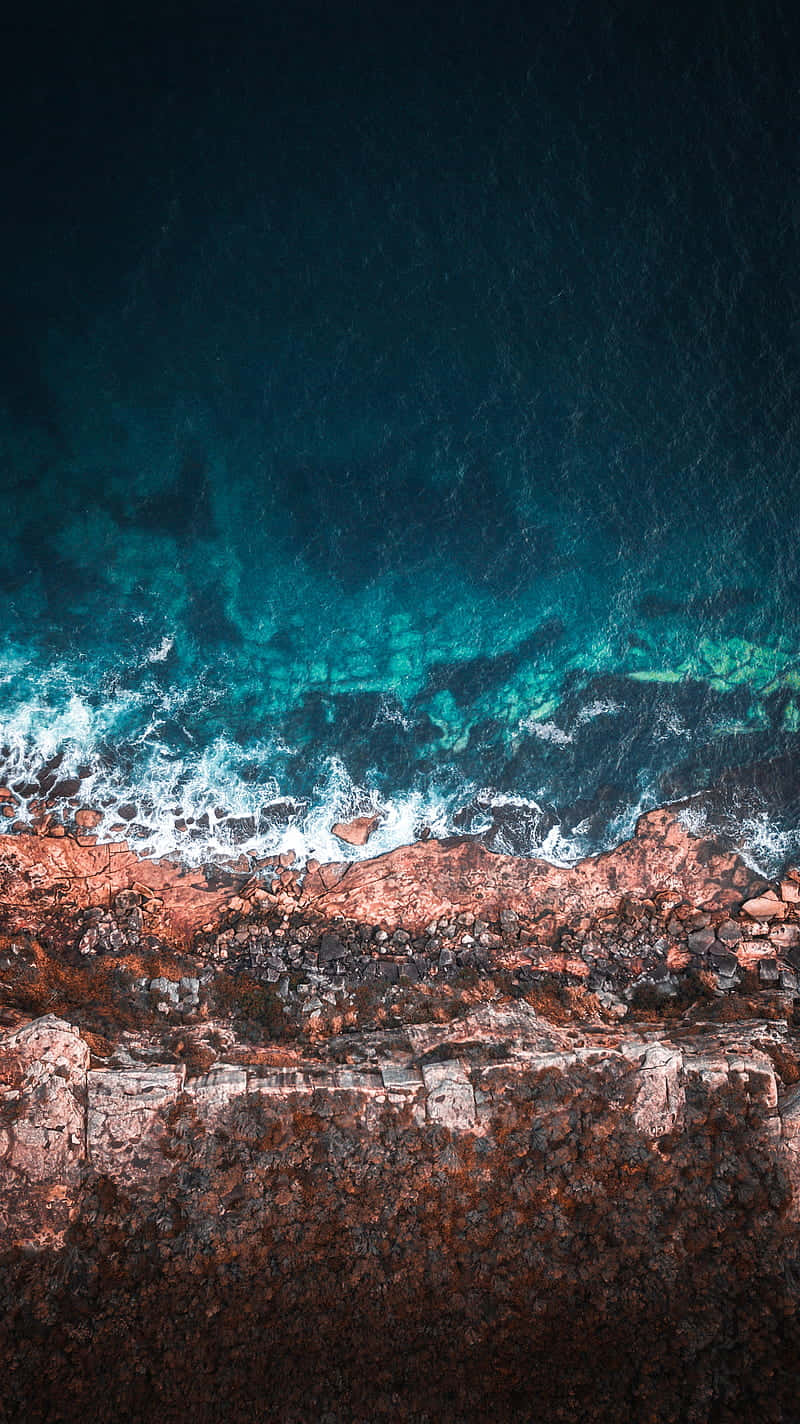 turquoise waves, rugged reddish-brown cliffs, deep blue water, HD Phone Wallpaper