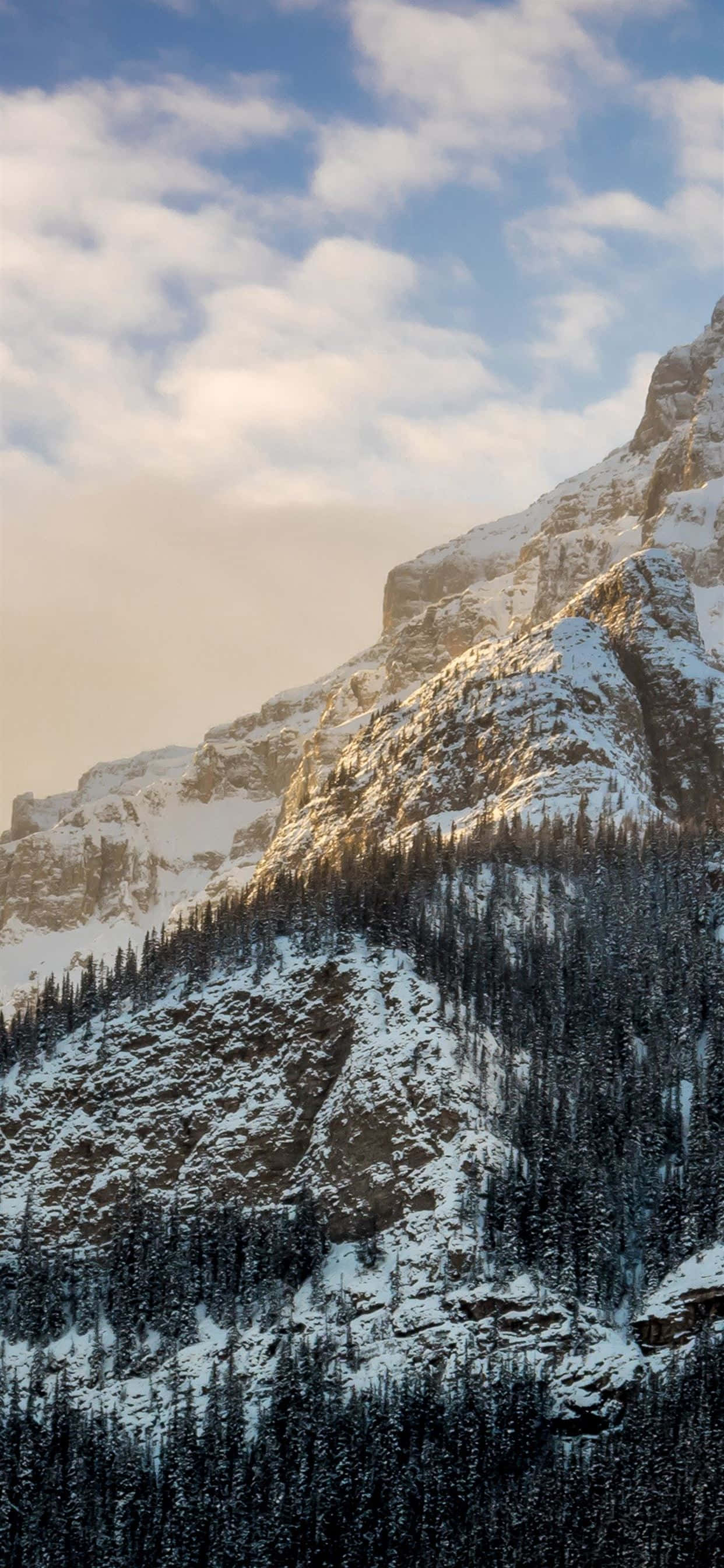 Nature Winter iPhone, snow-capped mountain ridge, golden sunrise light, 2K Phone Wallpaper
