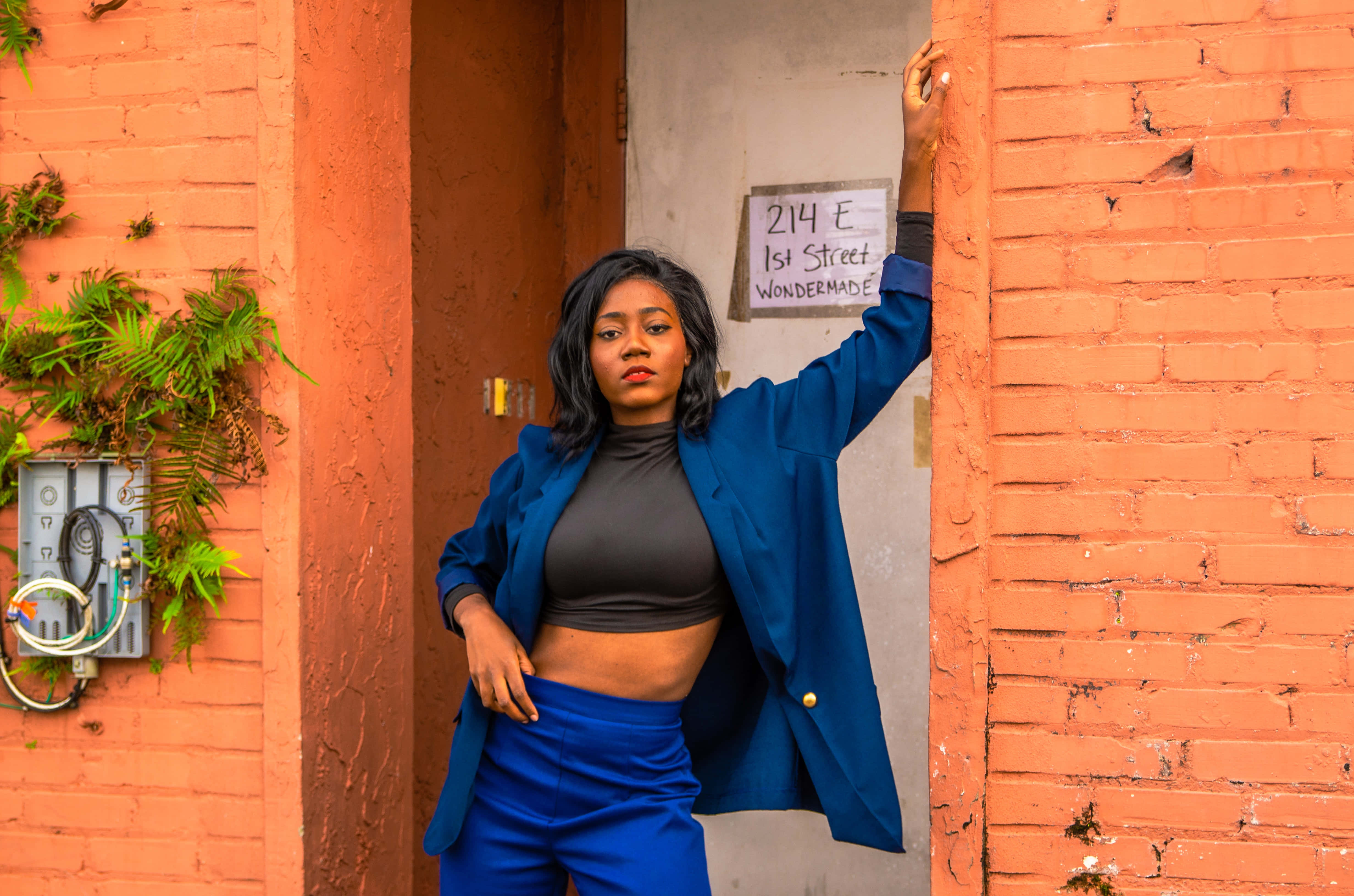 Navy Blue Blazer, orange brick walls, greenery, 4K Desktop Wallpaper
