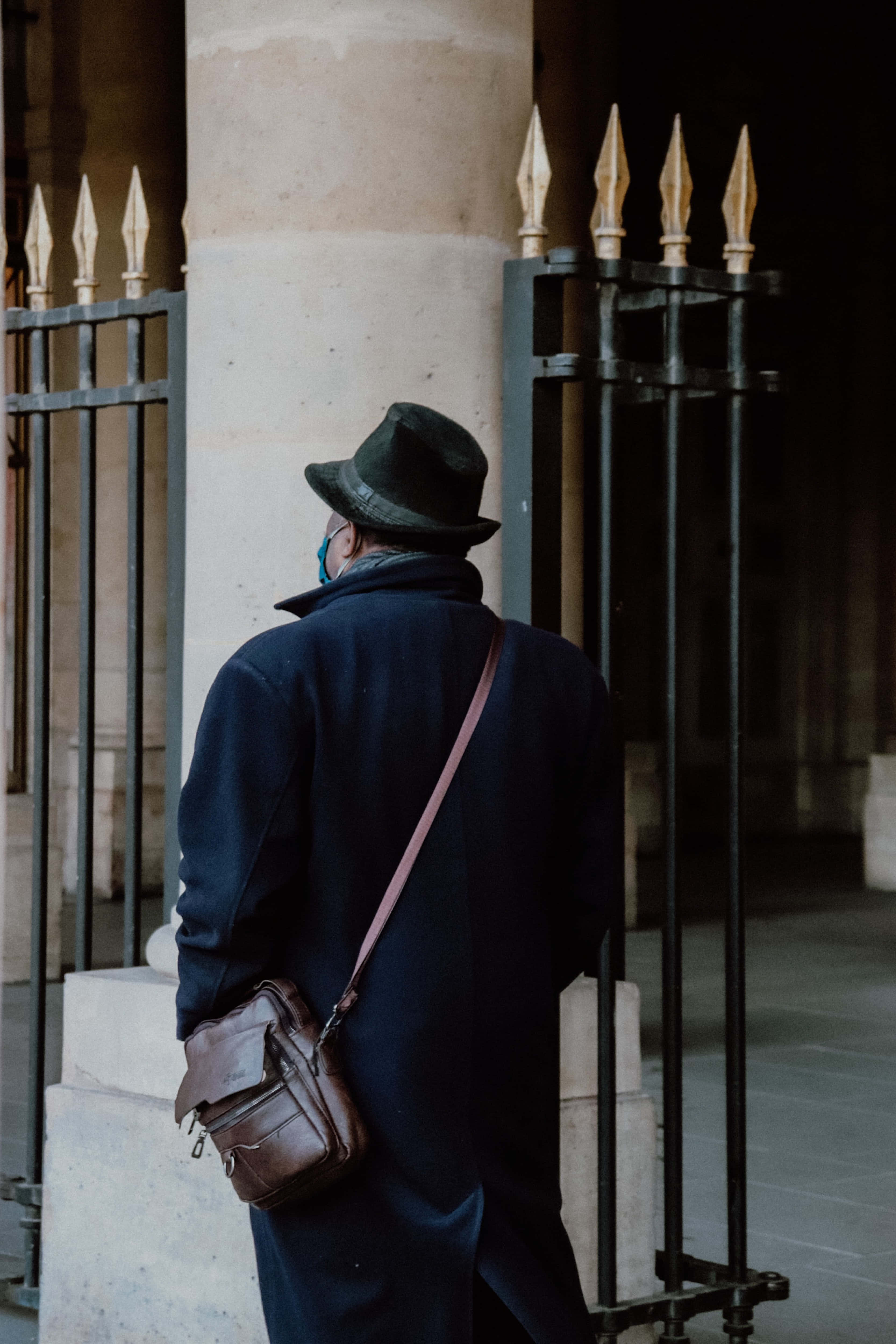 Navy Blue Coat, fedora, ornate iron gates, 4K Phone Wallpaper