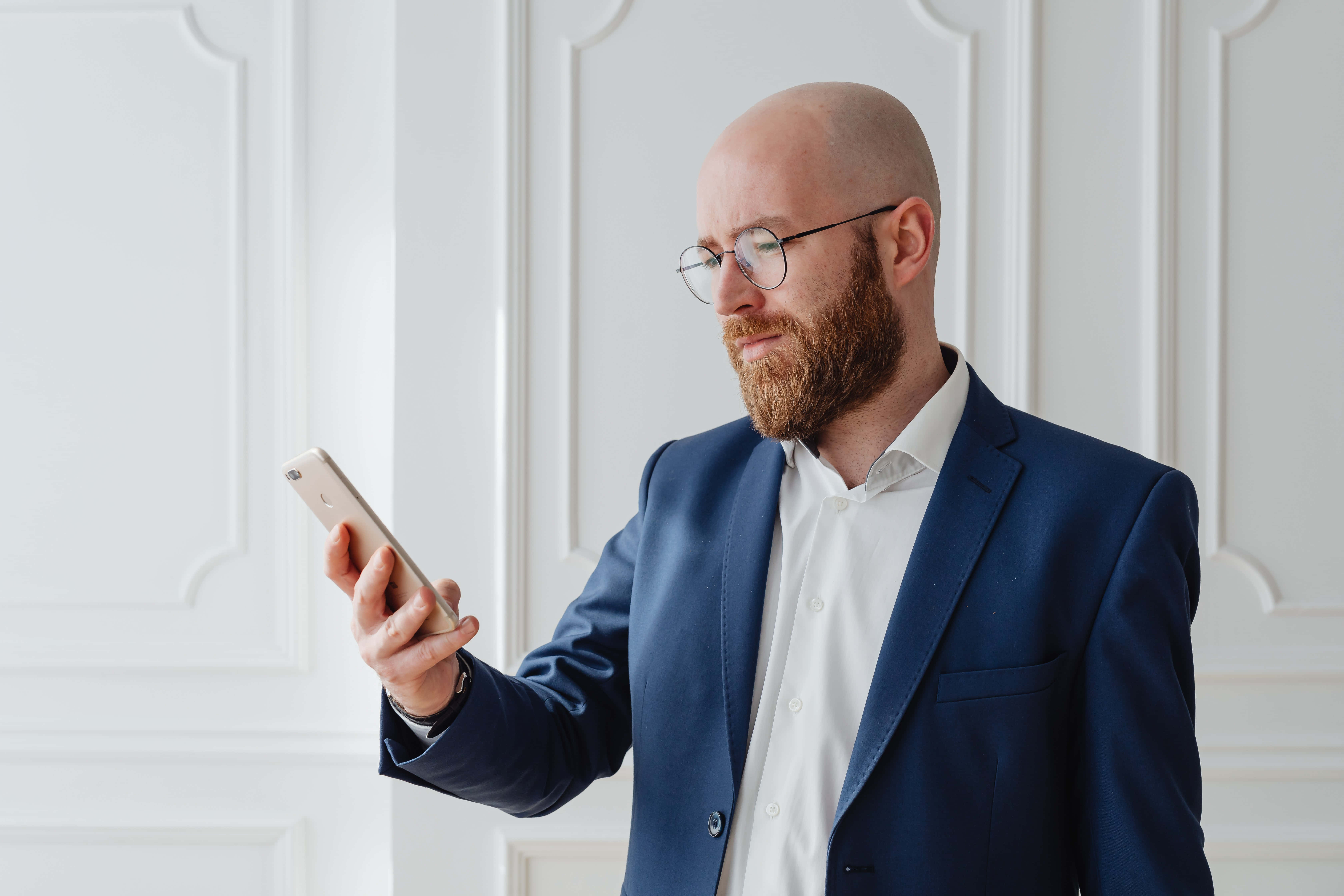 navy blue suit, bald bearded man, glasses, 5K Desktop Wallpaper