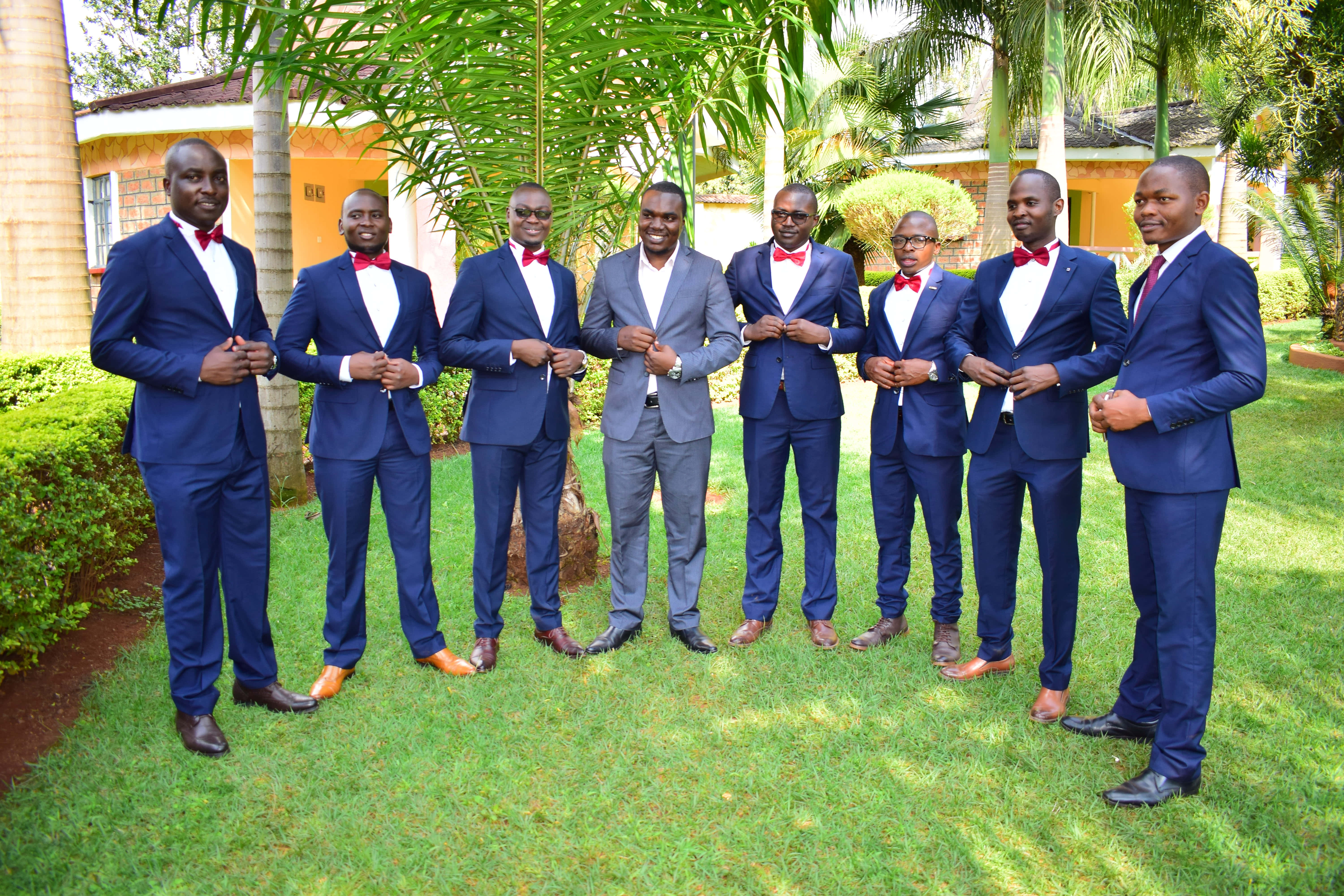 navy blue suit, red bow ties, sunlit green lawn, 5K Desktop Wallpaper