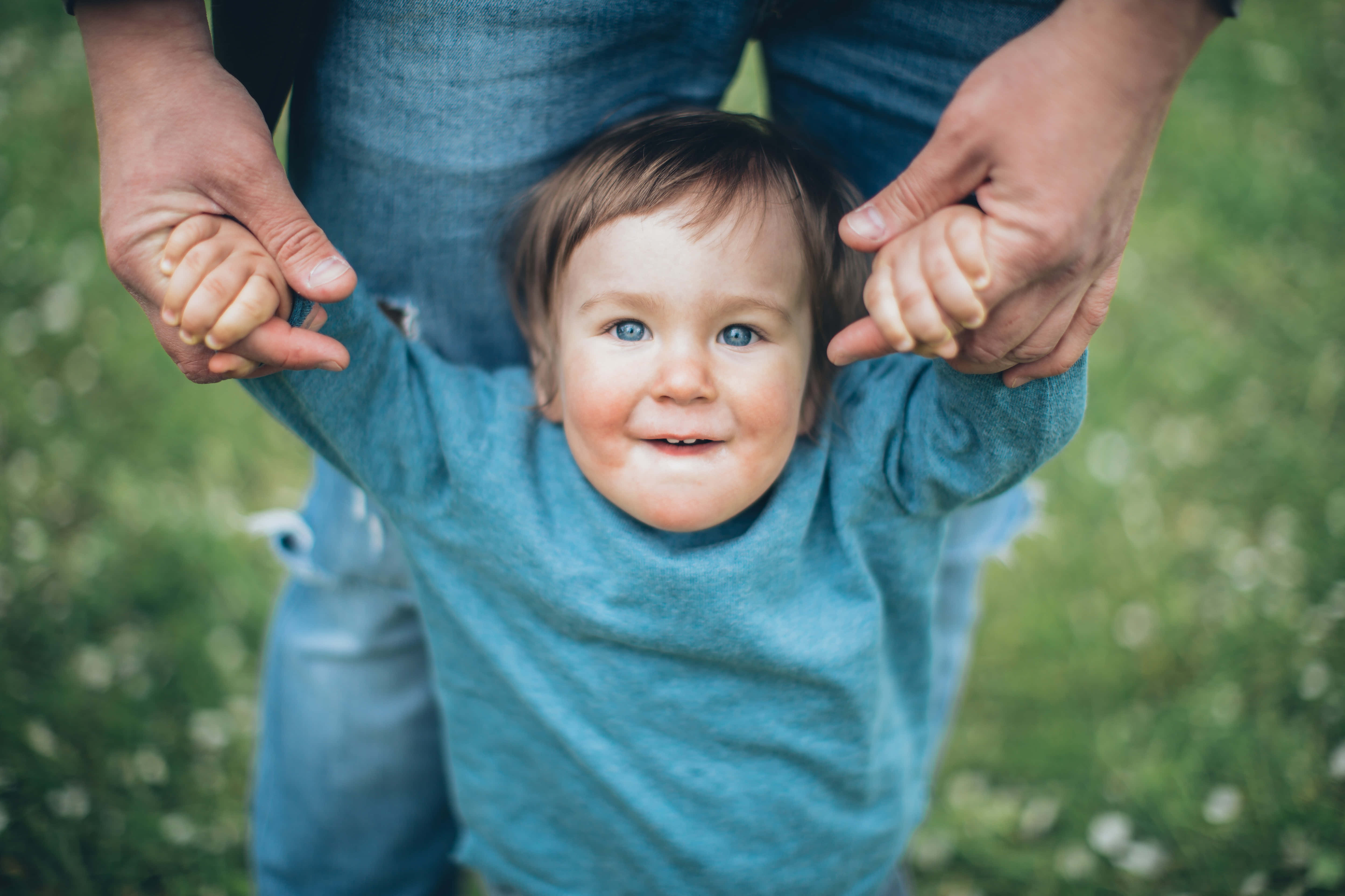 navy blue sweater, bright blue eyes, grassy field, 5K Desktop Wallpaper