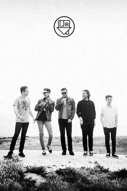 The Neighbourhood, rocky outcrop, vast pale sky, SD Phone Wallpaper