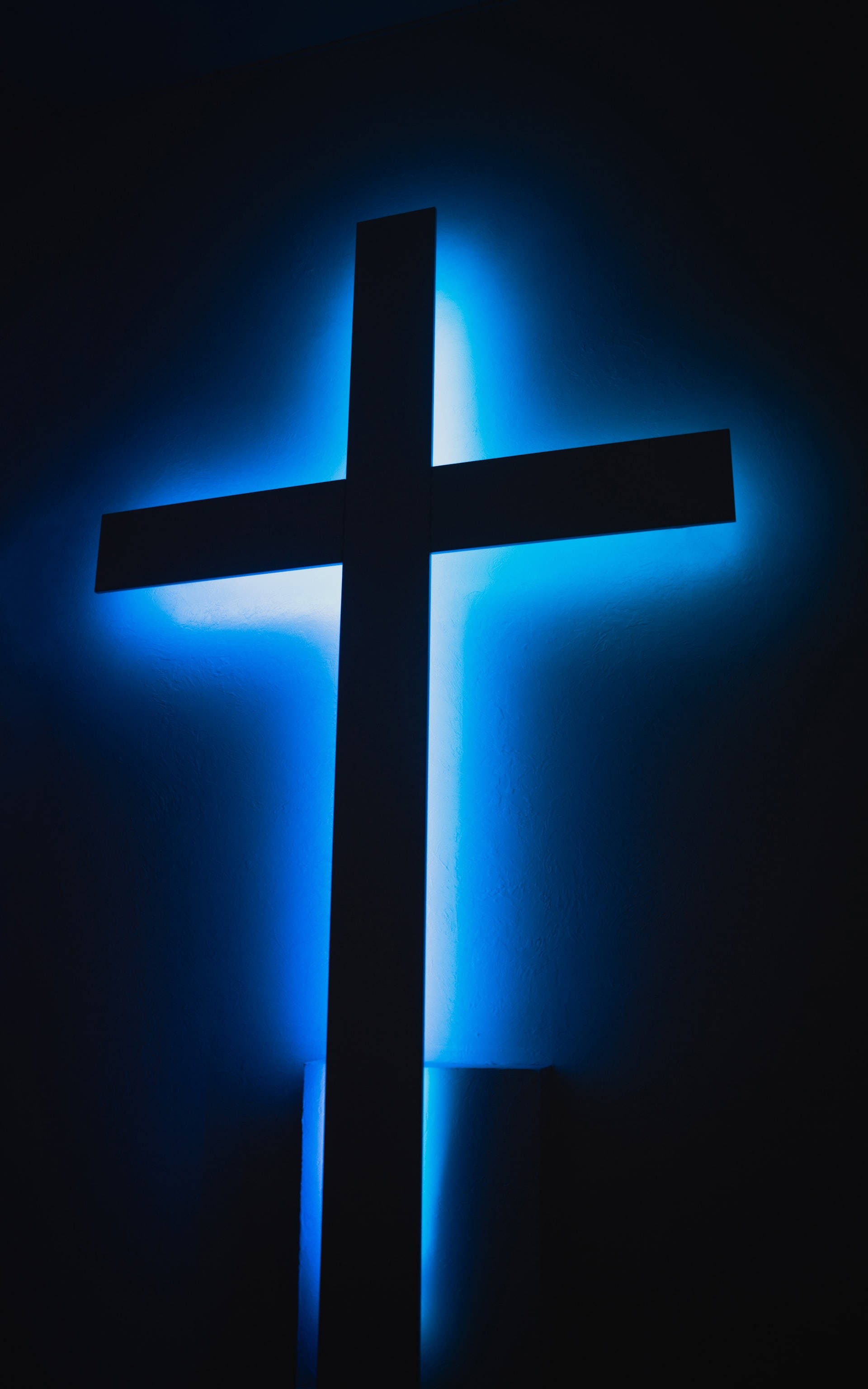 Neon Blue iPhone, glowing blue cross silhouette, radiant glow, 2K Phone Wallpaper