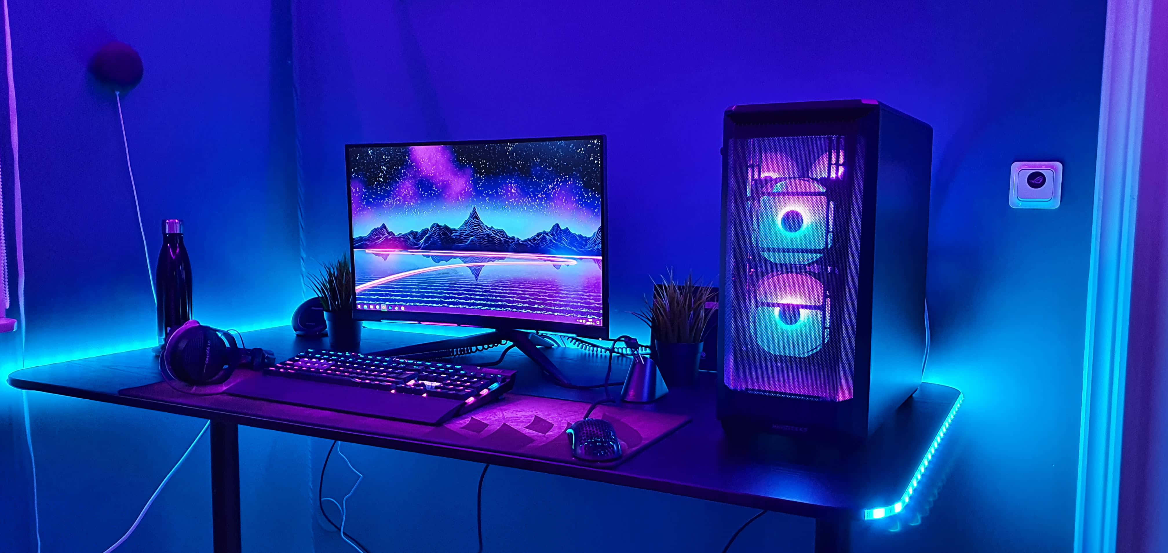 Cyberpunk Style Gaming Setup, glowing blue and purple, mountain wallpaper, 4K Desktop Wallpaper