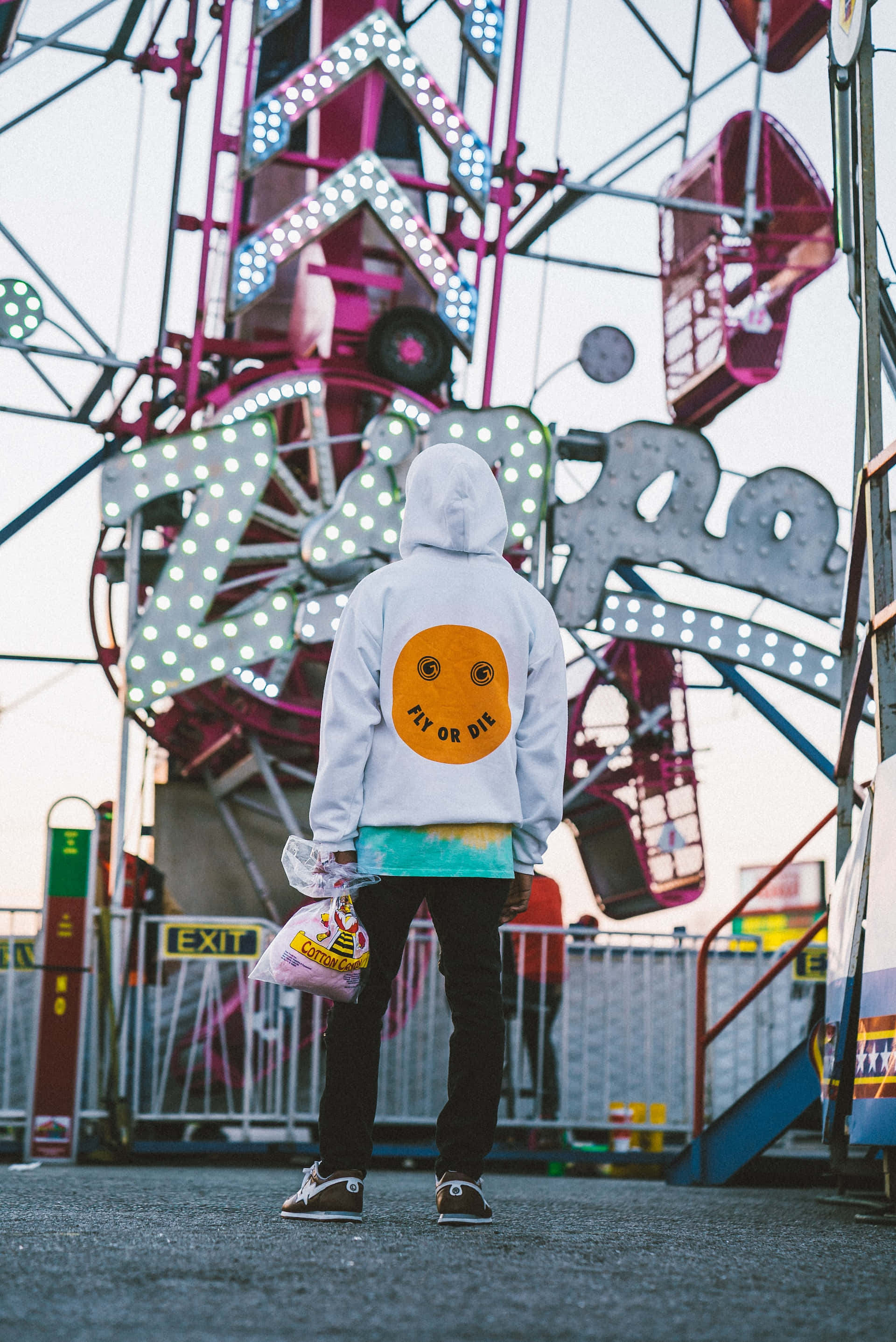 white hoodie, yellow smiley face, colorful, lit-up carnival ride, 2K Phone Wallpaper