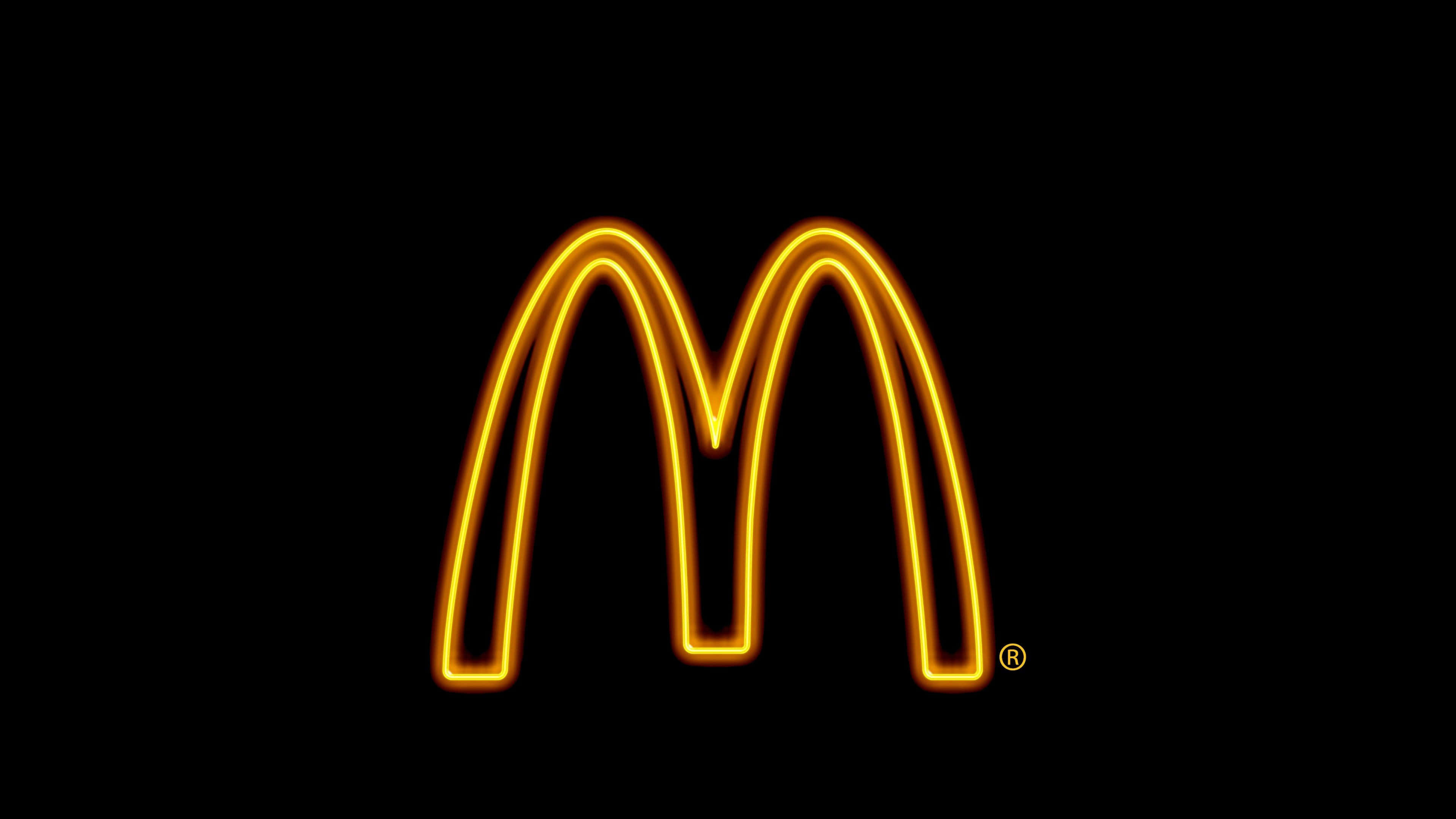 Neon Lights Tumblr Laptop, glowing golden arches logo, solid black background, 4K Desktop Wallpaper